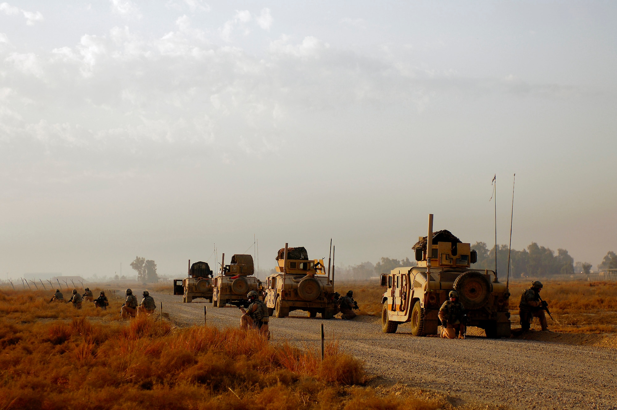 Air Force security forces Airmen perform a dry run of rollover drills Mar. 3 prior to a patrol in the southwest area of Baghdad, Iraq.  The Airman are assigned to Detachment 3 of the 732nd Expeditionary Security Forces Squadron at Sather Air Base, Iraq. (U.S. Air Force photo/by Master Sgt. Andy Dunaway)