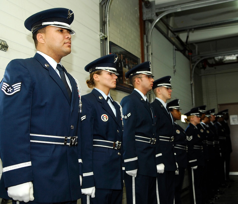 LANGLEY AIR FORCE BASE, Va. -- Langley's Honor Guard stands at attention during the graduation ceremony Feb. 21. Airmen who are interested in joining the honor guard must be E-1 to E-5 and can’t be on a medical waiver. During the ten day training, Airmen learn color guard, pall bearing, flag folding, firing parties and how to maintain military bearing and professionalism. (U.S. Air Force photo/Airman Gul Crockett)