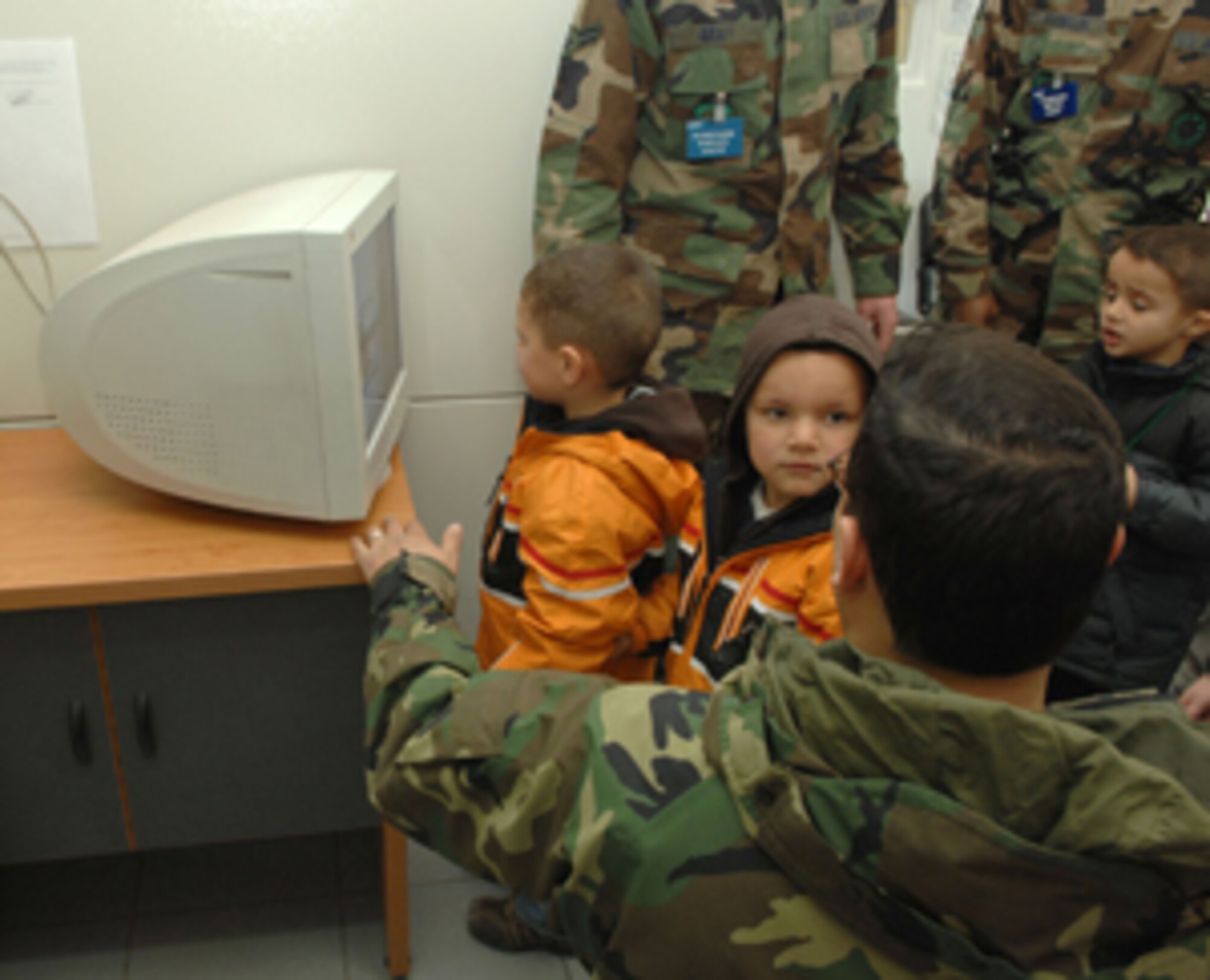 Incirlik Unit School pre-school students are shown the X-ray machine at the passenger terminal as part of the full transportation experience. The students took a field trip through the 39th Logistics Readiness Squadron's transportation department and the 728th Air Mobility Squadron passenger terminal Feb. 20 to learn how cargo and people are transported from place-to-place.