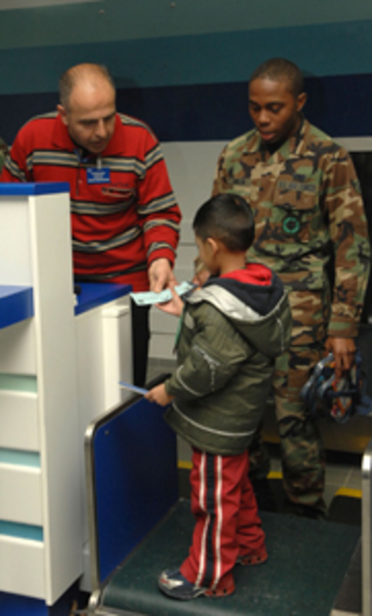 Incirlik Unit School pre-school students are weighed and recieve a boarding pass as part of the full transportation experience. The students took a field trip through the 39th Logistics Readiness Squadron's transportation department and the 728th Air Mobility Squadron passenger terminal Feb. 20 to learn how cargo and people are transported from place-to-place.