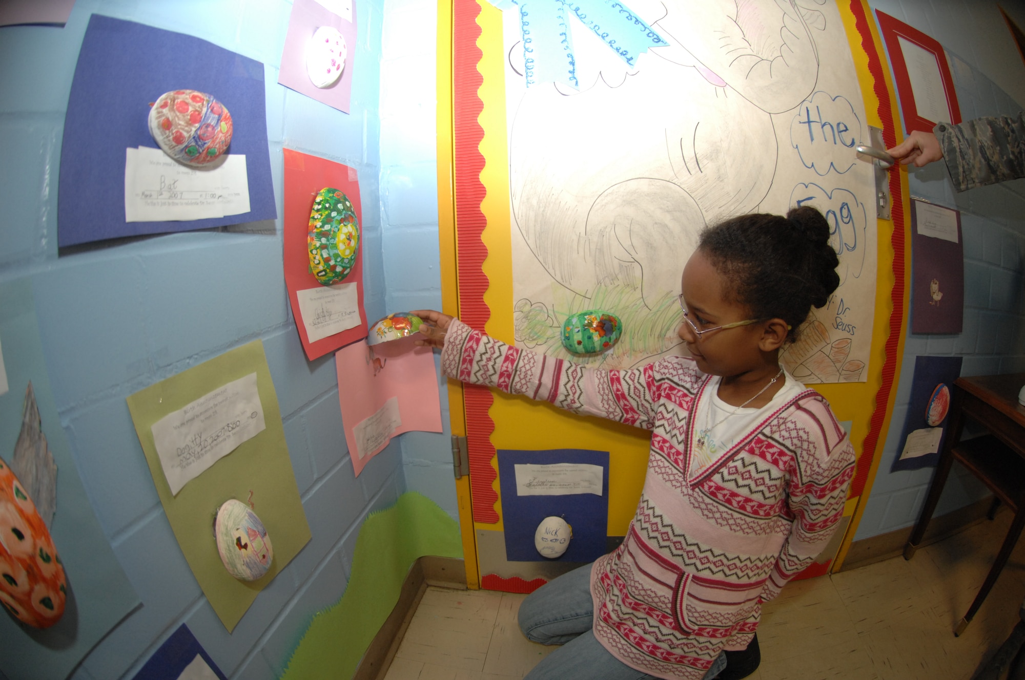 Spangdahlem AB, Germany- Celeste Fleming, daughter of Staff Sergeant Tahiana Sanders 52 Communications Squadron, shows of the egg she created March 7, 2008 at Spangdahlem Elementary School Door Decorating Contest as part of Read Across America week. (U.S. Air Force photo by Airman 1st Class Jenifer Calhoun)
