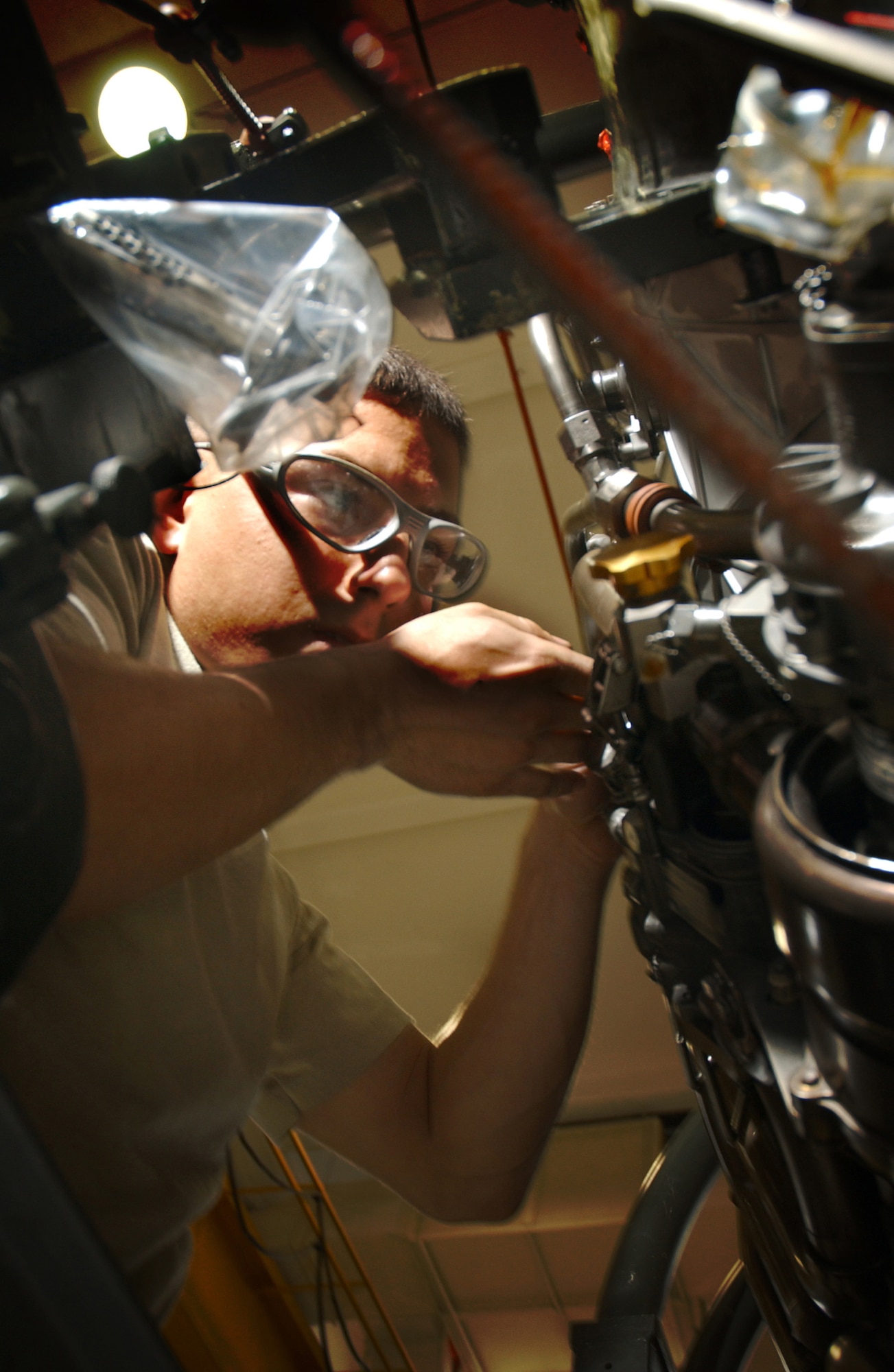 Airman 1st Class Paul Guajardo, 18th Component Maintenance Squadron Propulsion Flight, performs routine maintenance on the compression bleed cylinders of an F-15 during the 2008 Pacific Air Forces Operational Readiness Inspection at Kadena Air Base, Japan, March 10, 2008. PACAF is conducting the inspection from March 9 to 15 to validate the mission readiness of the 18th Wing.
(U.S. Air Force photo/Senior Airman Jeremy McGuffin)