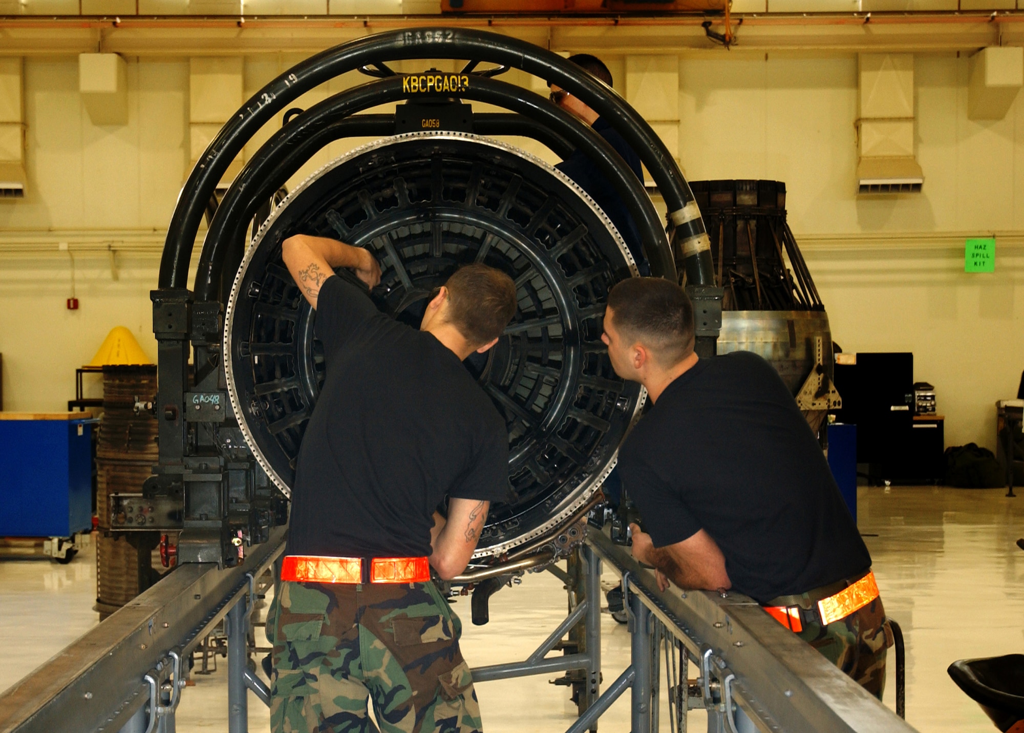 Airman 1st Class Jayson Pearce, 18th Component Maintenance Squadron Propulsion Flight, removes bolts securing the flame holder in place for a F-15 engine as his supervisor looks on during the 2008 Pacific Air Forces Operational Readiness Inspection at Kadena Air Base, Japan, March 10, 2008. PACAF is conducting the inspection from March 9 to 15 to validate the mission readiness of the 18th Wing.
(U.S. Air Force photo/Senior Airman Jeremy McGuffin) 