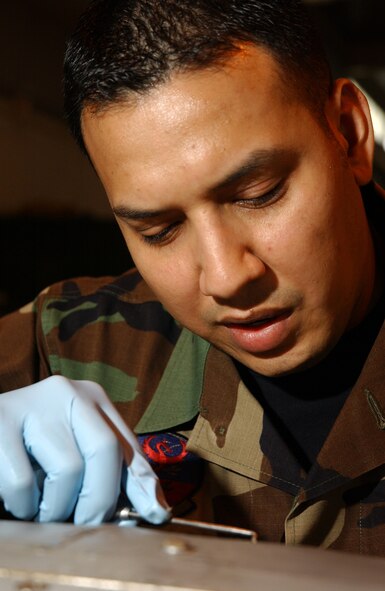 Staff Sgt. Gerardo Valdez, 18th Component Maintenance Squadron Fuels Flight, seals all the bolts and rivets for an F-15 external fuel tank, before running pressurized checks for leaks during the 2008 Pacific Air Forces Operational Readiness Inspection at Kadena Air Base, Japan, March 10, 2008. PACAF is conducting the inspection from March 9 to 15 to validate the mission readiness of the 18th Wing.
(U.S. Air Force photo/Senior Airman Jeremy McGuffin)