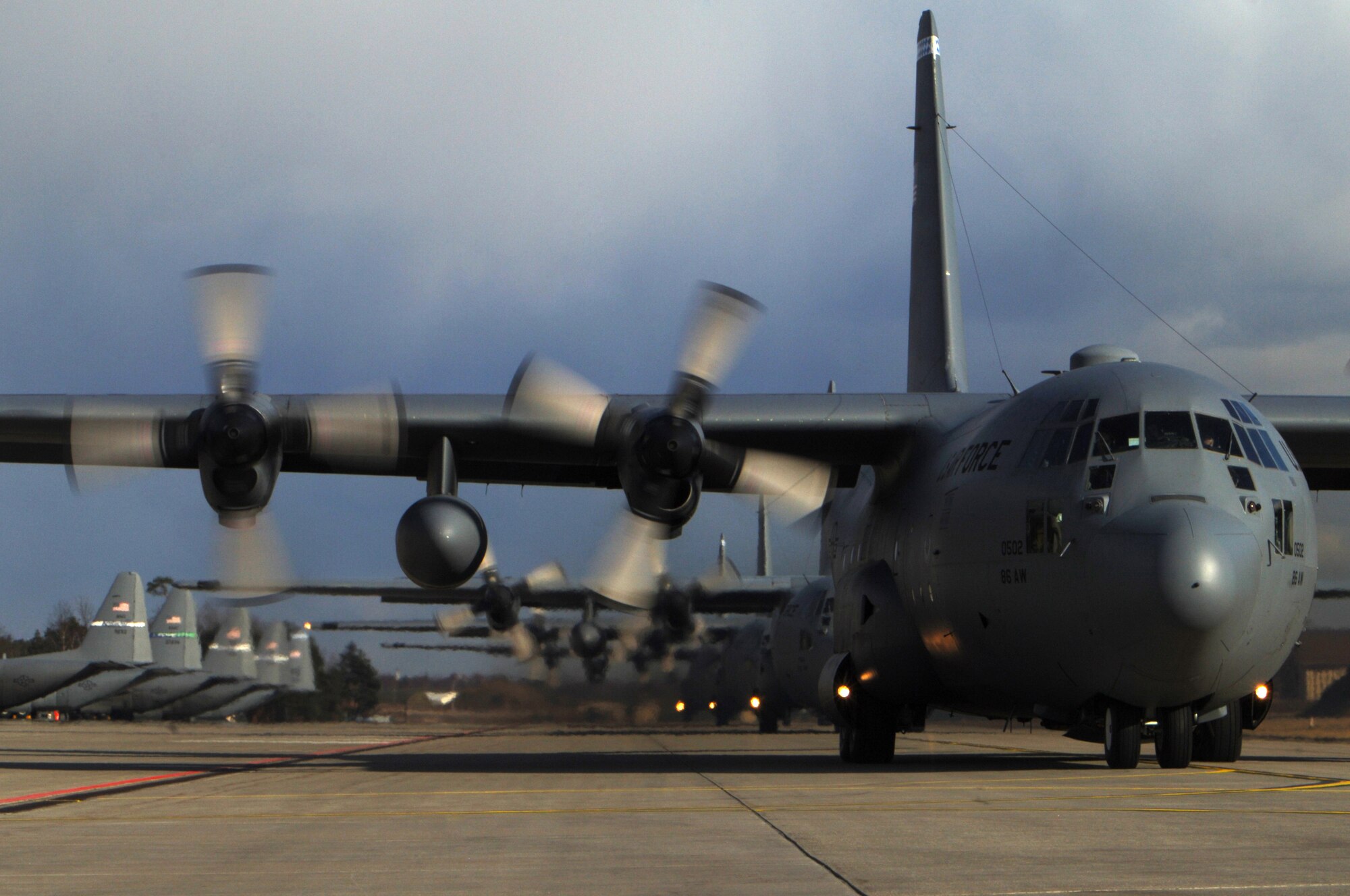 86th Airlift Wing C-130s prepare to depart Ramstein March 5 for mass tactical training, allowing aircrew to maintain proficiency in large formation flying and airdrop operations. Photo by Senior Airman Melissa Sheffield*