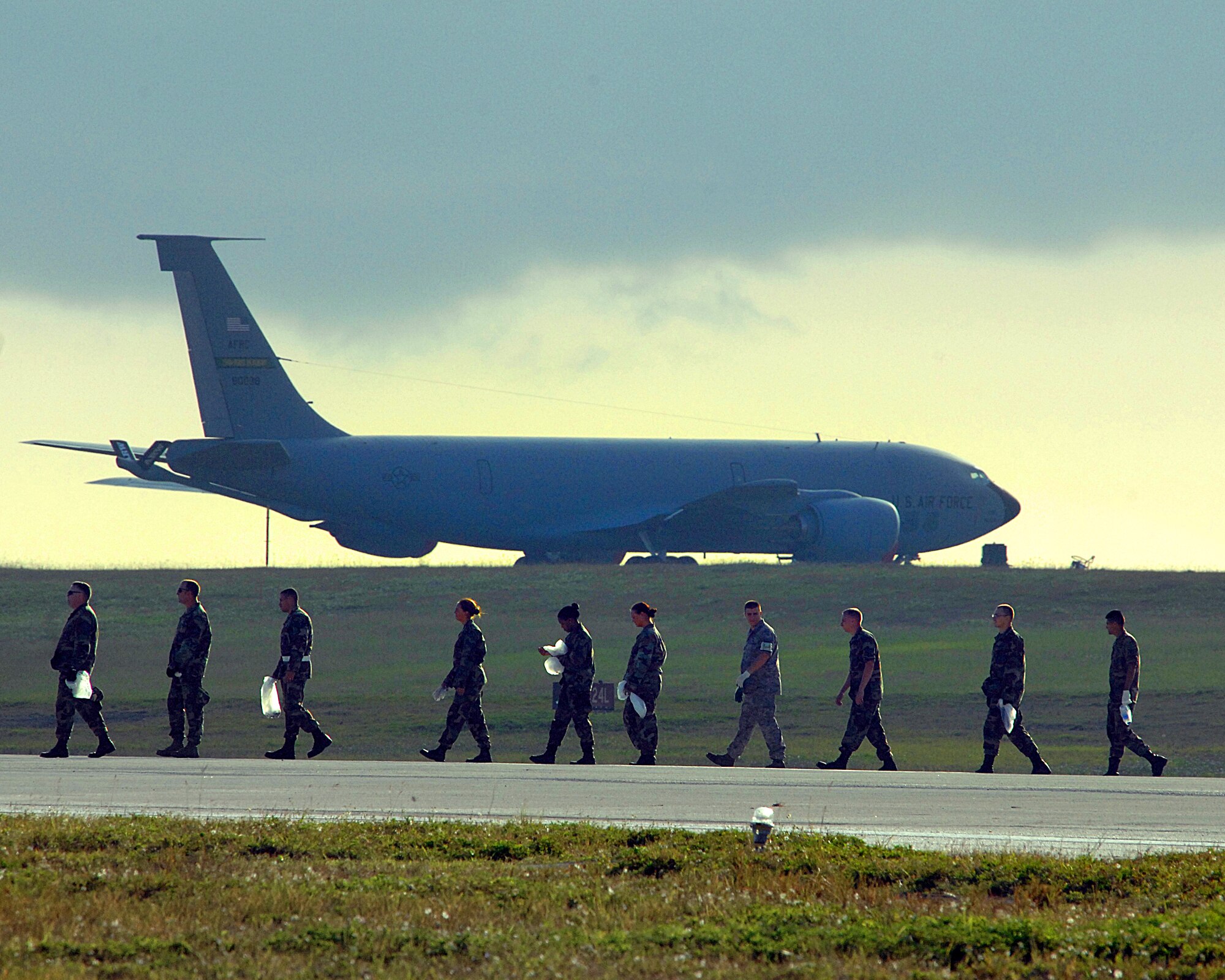 ANDERSEN AFB, Guam-- The 96th Expeditionary Bomb Squadron, deployed here from Barksdale, La., and members of the 36th Wing scan the airfield for foreign object debris, or FOD. The wing is clearing the airfield to re-open a runway that has been closed since a B-2 bomber crashed here.  (U.S. Air Force Photo by Staff Sgt. Vanessa Valentine) 