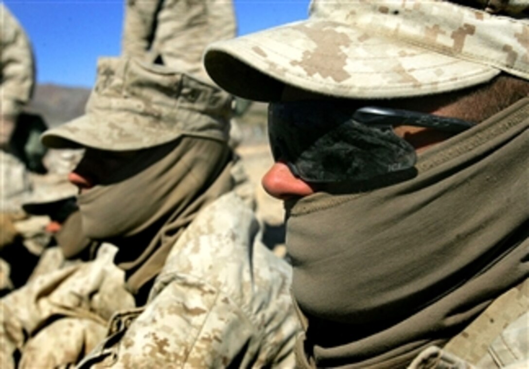 Pfc. Luke Mantalica, a rifleman with 2nd Battalion, 7th Marine Regiment, watches an impromptu first-aid class at Exercise Mojave Viper at Marine Corps Air Ground Combat Center, Twentynine Palms, Calif., Mar. 5, 2008. The trainees will soon deploy to Afghanistan.  