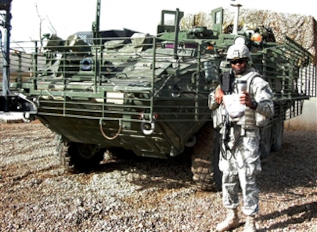 Spc. Darryl Lindsey enjoys a cup of freshly brewed Kona coffee before mounting up on his Stryker for a mission, Mar. 8th, 2008. Lindsey is assigned to the 2nd Stryker Brigade Combat Team, 25th Infantry Division, Multi-National Division – Baghdad.