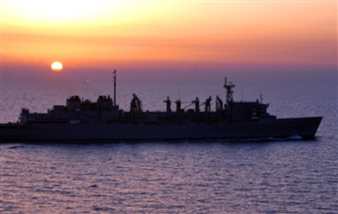 The Military Sealift Command fast combat support ship USNS Arctic sails in the Persian Gulf at dusk, March 8, 2008