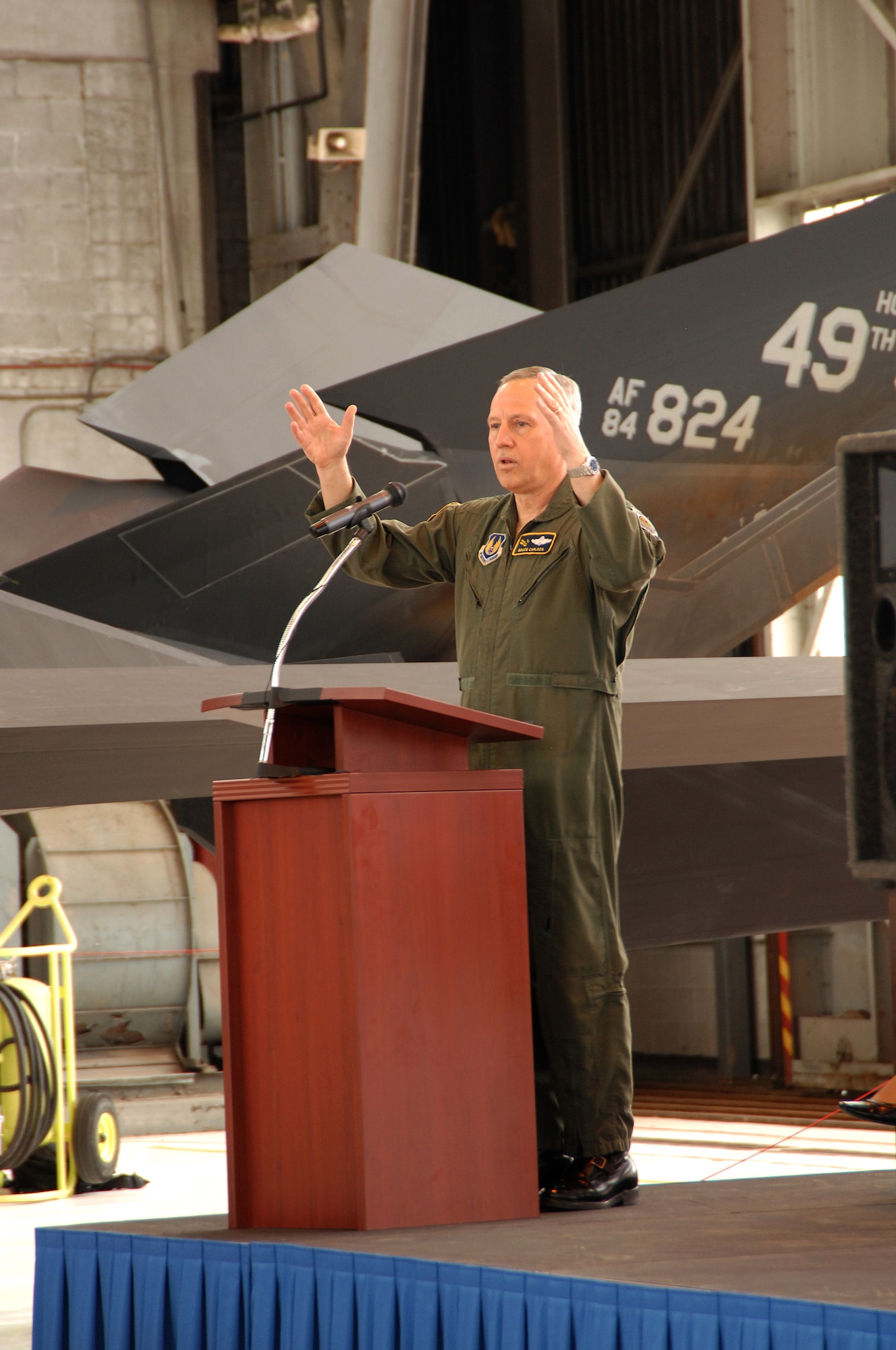 Gen. Bruce Carlson, Air Force Materiel Command commander, speaks during a retirement ceremony honoring the F-117A Nighthawk.  The Air Force is retiring the stealth fighter fleet because newer capabilities exist and it is expensive to operate and maintain.  Savings will be applied to help modernize the across the Air Force. (U.S. Air Force photo by Ben Strasser)