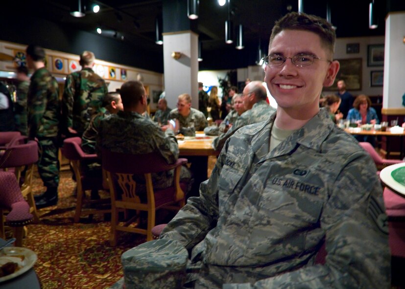 FAIRCHILD AIR FORCE BASE, Wash. – Staff Sgt. Thomas Locke, 92nd Communications Squadron network administration supervisor, smiles for the camera during a promotion celebration honoring lieutenant colonel selects at Club Fairchild March 6. Promotion celebrations are a tradition in the Air Force, serving as an opportunity for Airmen to show their appreciation for promotees and their achievements. (U.S. Air Force photo / Airman 1st Class Joshua Chapman) 
