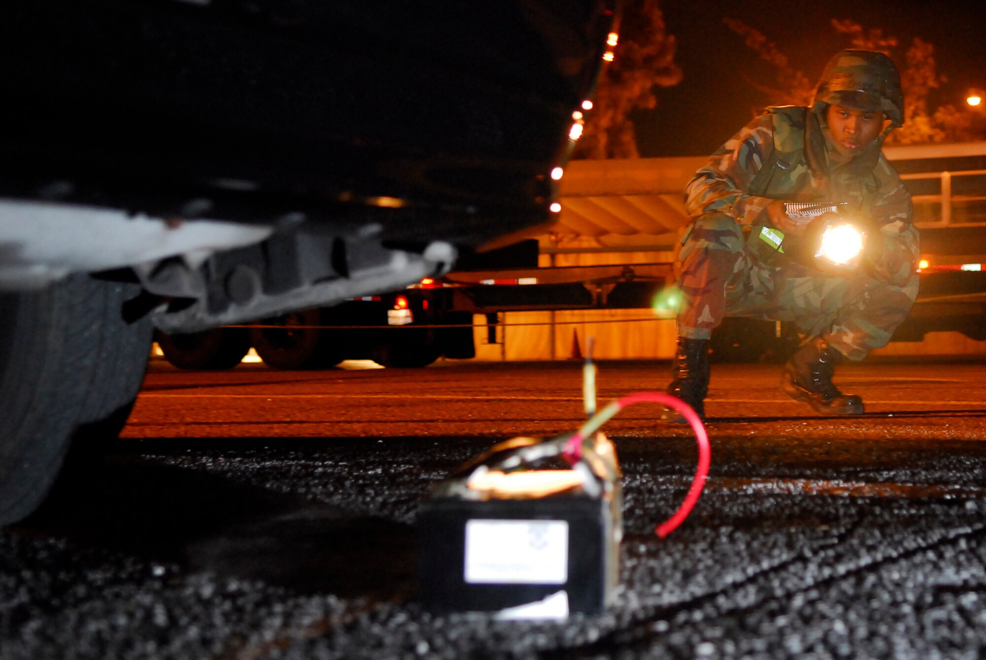 Airman Eugene Washington, 18th Logistics Readiness Squadron, locates an improvised explosive device during sweep team training for the 2008 Pacific Air Forces Operational Readiness Inspection at Kadena Air Base, Japan, March 12, 2008. PACAF conducted the inspection from March 9 to 15 to validate mission readiness of the 18th Wing. (U.S. Air Force photo/Staff Sgt. Joshua J. Garcia) 