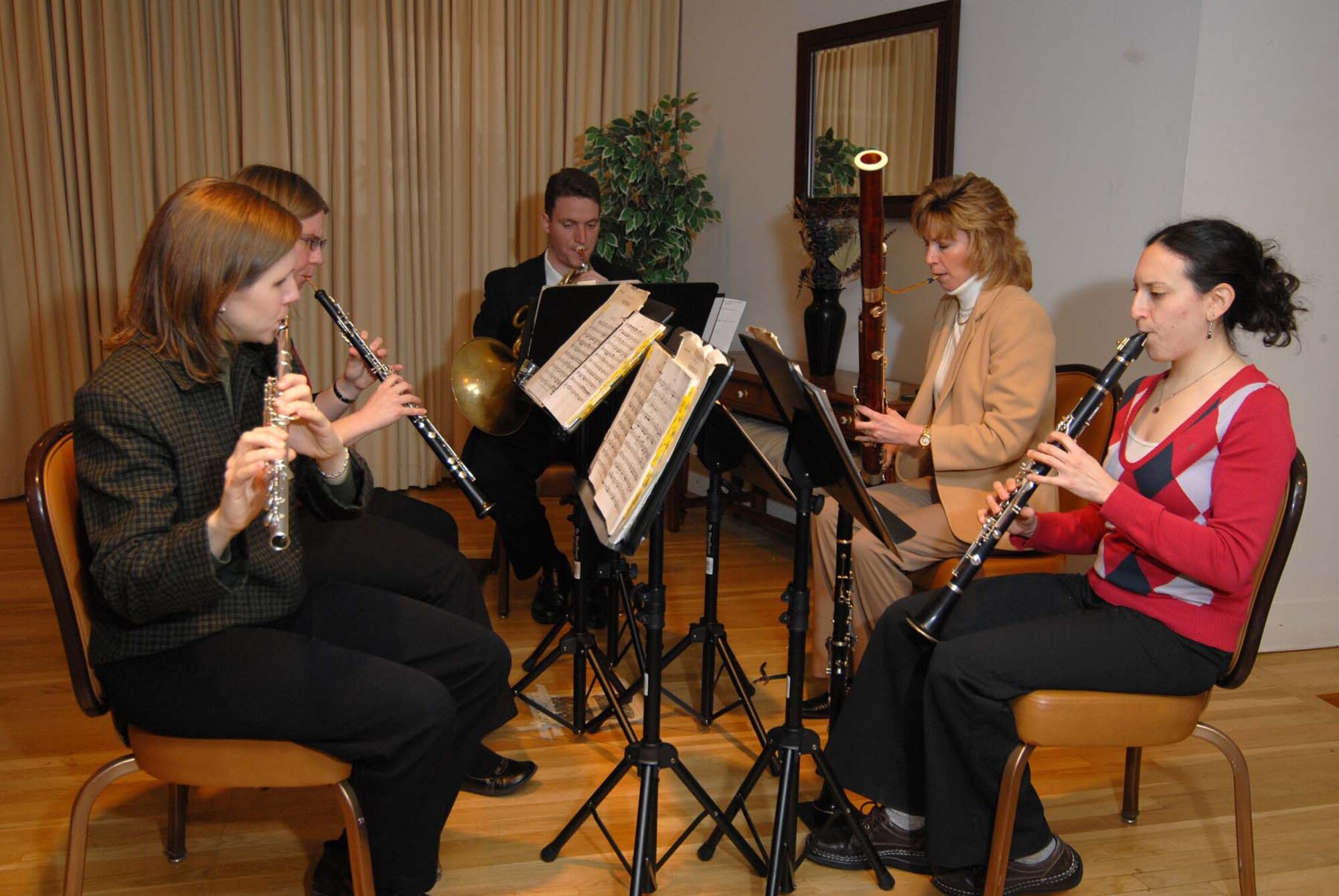 Members of the Great Falls Symphony Orchestra's "Chinook Winds" ensemble entertain Team Malmstrom members during the National Prayer Luncheon March 5 at the Grizzly Bend Club. (U.S. Air Force photo/John Turner)