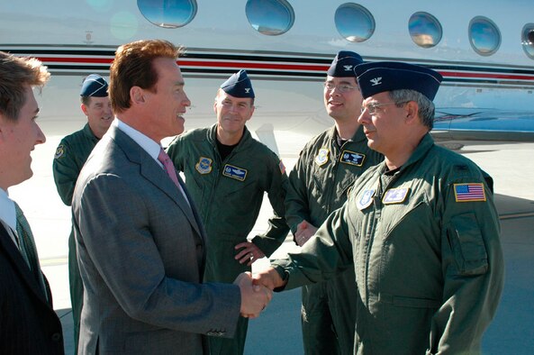 TRAVIS AIR FORCE BASE, Calif. -- Gov. Arnold Schwarzenegger is greeted by Col. Abel Barrientes, 349th Air Mobility Wing vice commander, after he landed at Travis AFB to pay a visit in Fairfield, Calif., March 10.  The visit to the area was to promote a state effort to recruit construction apprentices for public works projects. (U.S. Air Force photo/Tech. Sgt. Matthew McGovern)