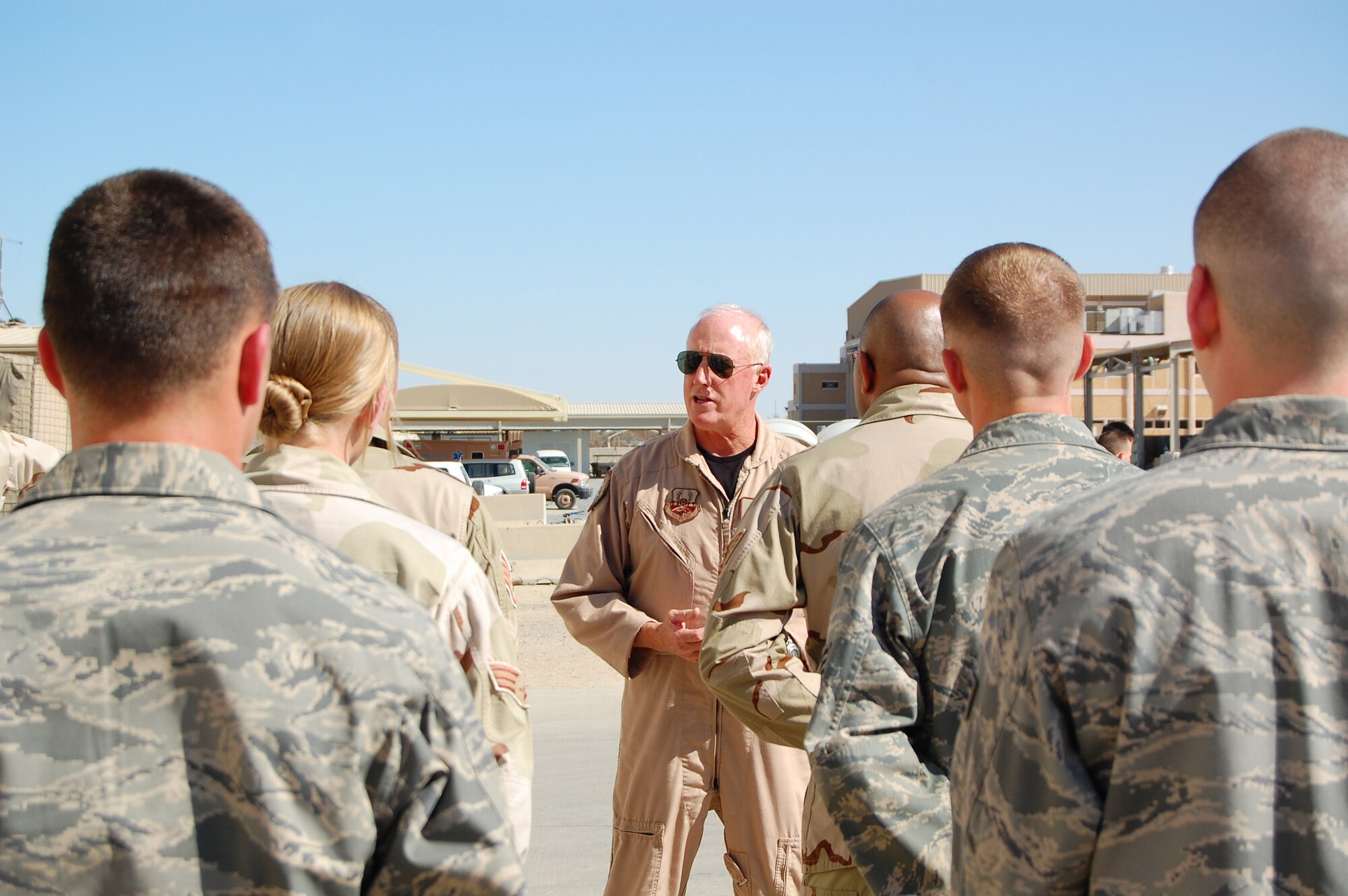 Brig. Gen. Thomas Haynes, U.S. Air Forces Central director of mobility forces, discusses deployed air mobility operations with Airmen during his visit to the 386th Air Expeditionary Wing March 8, 2008, at an air base in the Persian Gulf region.  The general visited the base to see first-hand how Airmen support the deployed airlift mission.