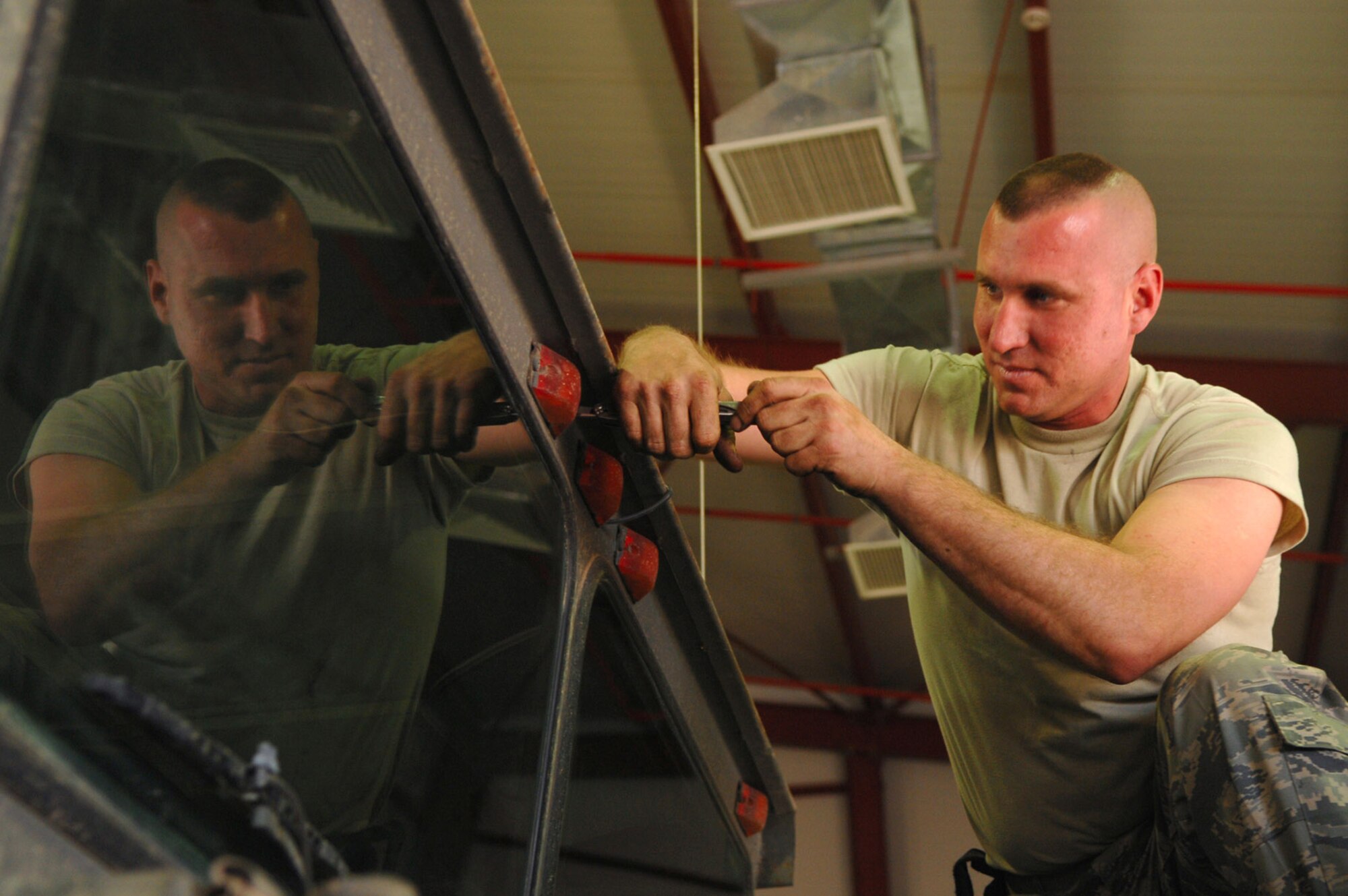 Staff Sgt. Jason Jablonowski reinstalls the clearance lights on a refueling truck March 8 at Balad Air Base, Iraq. Sergeant Jablonowski, a 332nd Expeditionary Logistics Readiness Squadron refueling truck mechanic, is deployed from Luke Air Force Base, Ariz. (U.S. Air Force photo/Senior Airman Julianne Showalter) 
