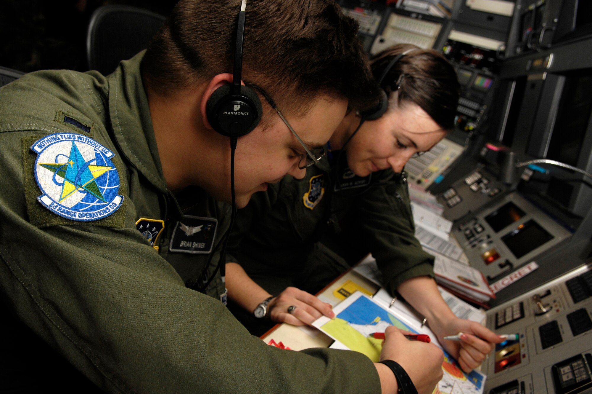 VANDENBERG AIR FORCE BASE, Calif. --  1st Lt. Brian Shimek and 2nd Lt. Sarah Goyen, instructors in the 2nd Range Operations Squadron here, work on instrumentation issue during a simulated launch March 10. Lieutenants Shimek and Goyen are part of the 30th Operations Group Guardian Challenge team. The team will compete in Guardian Challenge on March 24-26. (U.S. Air Force photo/Airman 1st Class Christian Thomas)