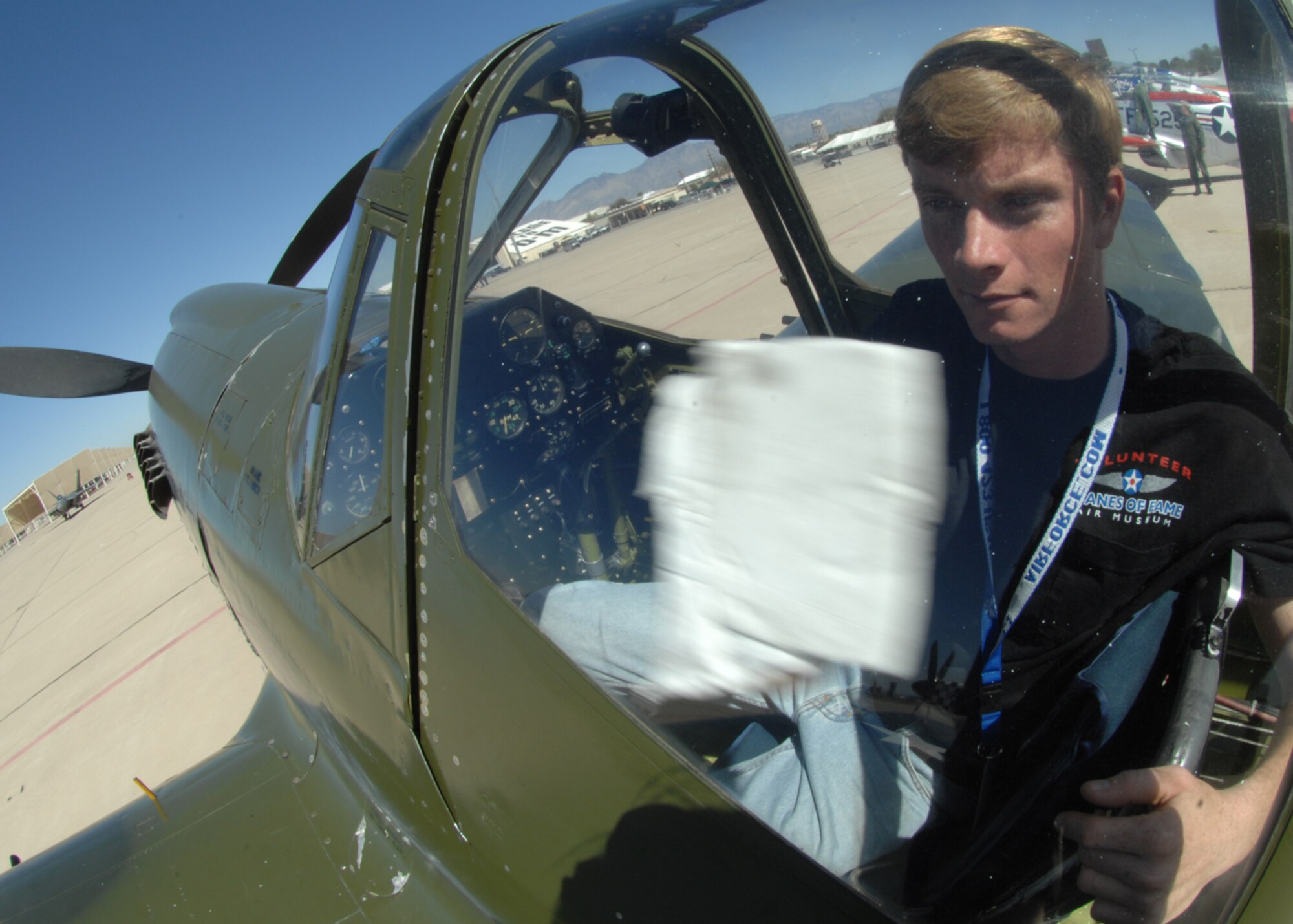 Steve Hinton cleans the inside windows of a P-40 Warhawk March 7, at Davis-Monthan AFB, Ariz during the 2008 Air Combat Command Heritage Flight Conference. Mr. Hinton is a crew member for the P-40 Warhawk, which is based out of Chino, CA at the Planes of Fame Air Museum. The Heritage Flight Conference allows civilian and military pilots to train together in preparation for the spring and summer air show seasons. (U.S. Air Force photo/Senior Airman Christina D. Kinsey)