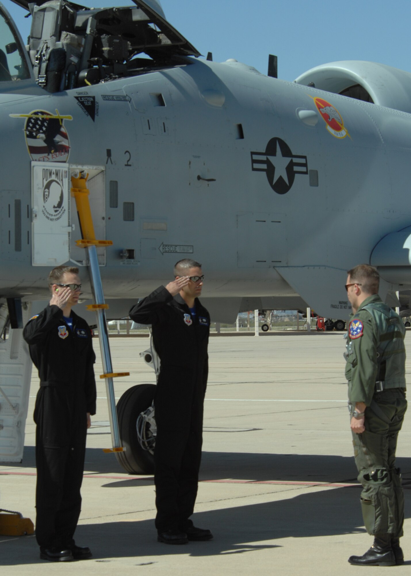 Staff Sgt. Matthew Baily and Senior Airman Josh Ames, crew chiefs with the A-10 West Demonstration Team salute Capt. Paul Brown, A-10 West demo pilot, before he climbs into his aircraft, March 7 at Davis-Monthan AFB, Ariz during the 2008 Air Combat Command Heritage Flight Conference. The A-10 West demo team consists of a select group of professionals that are dedicated to showing the extreme capabilities of the A-10 aircraft through exceptional aerial maneuvers. (U.S. Air Force photo/Senior Airman Christina D. Kinsey)