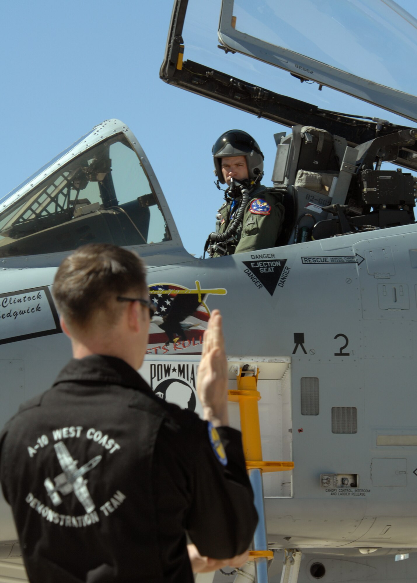 Staff Sgt. Matthew Baily, a crew chief with the A-10 West Demonstration Team communicates with Capt. Paul Brown, A-10 West demo pilot, as he performs pre-flight inspections prior to take-off, March 7 at Davis-Monthan AFB, Ariz during the 2008 Air Combat Command Heritage Flight Conference. The A-10 West demo team consists of a select group of professionals that are dedicated to showing the extreme capabilities of the A-10 aircraft through exceptional aerial maneuvers. (U.S. Air Force photo/Senior Airman Christina D. Kinsey)
