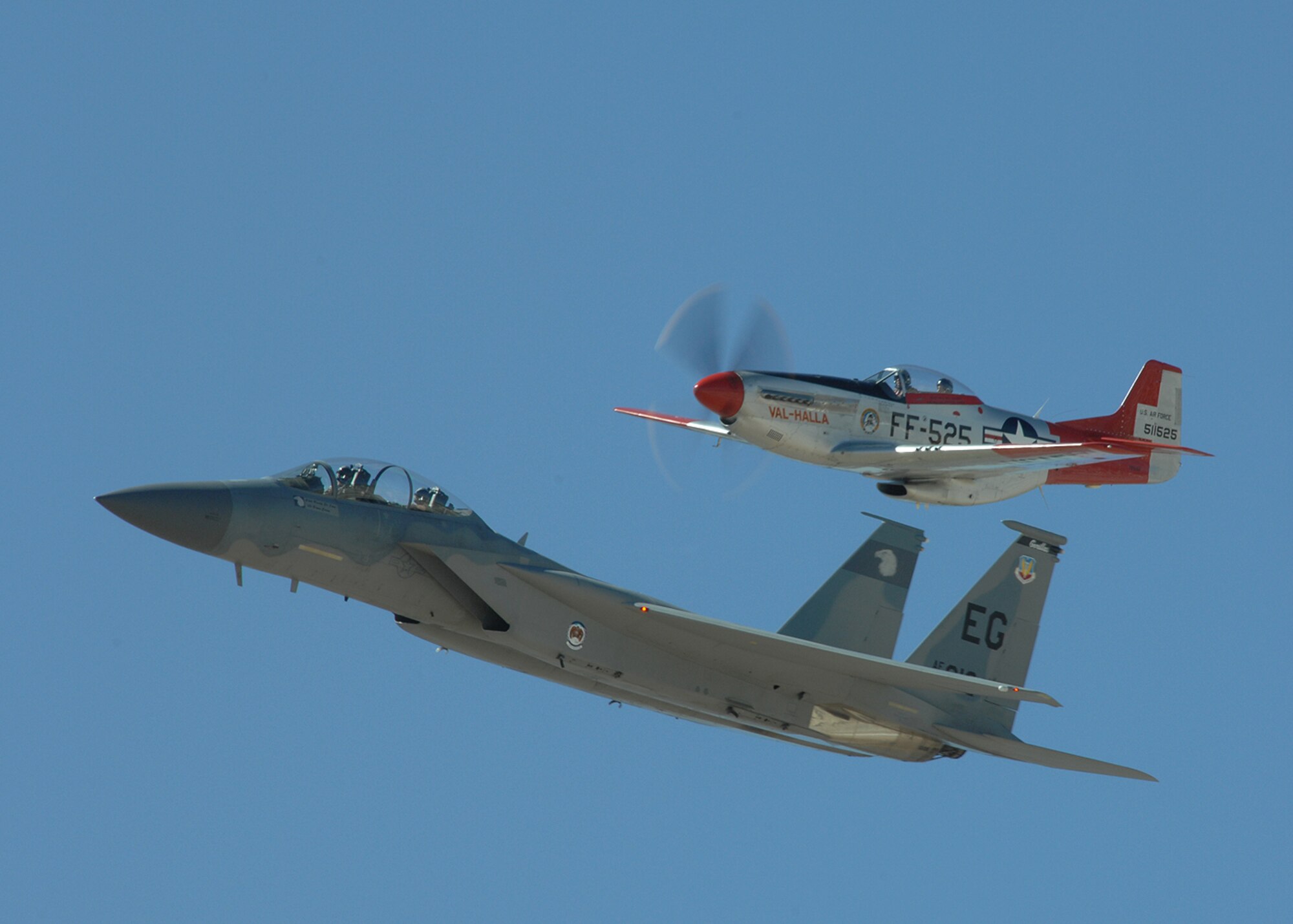 A F-15 from the West Coast Demonstration Team stationed out of Tyndall AFB, FL and a P-47 Thunderbolt fly in formation as part of an aerial demonstration during the 2008 Air Combat Command Heritage Flight Conference at Davis-Monthan AFB, Ariz March 7. The Heritage Conference provides an opportunity for Air Combat Command demonstration pilots to train together with modern and historic military aircraft in preparation for the upcoming air show seasons. (U.S. Air Force photo/Senior Airman Christina D. Kinsey)
