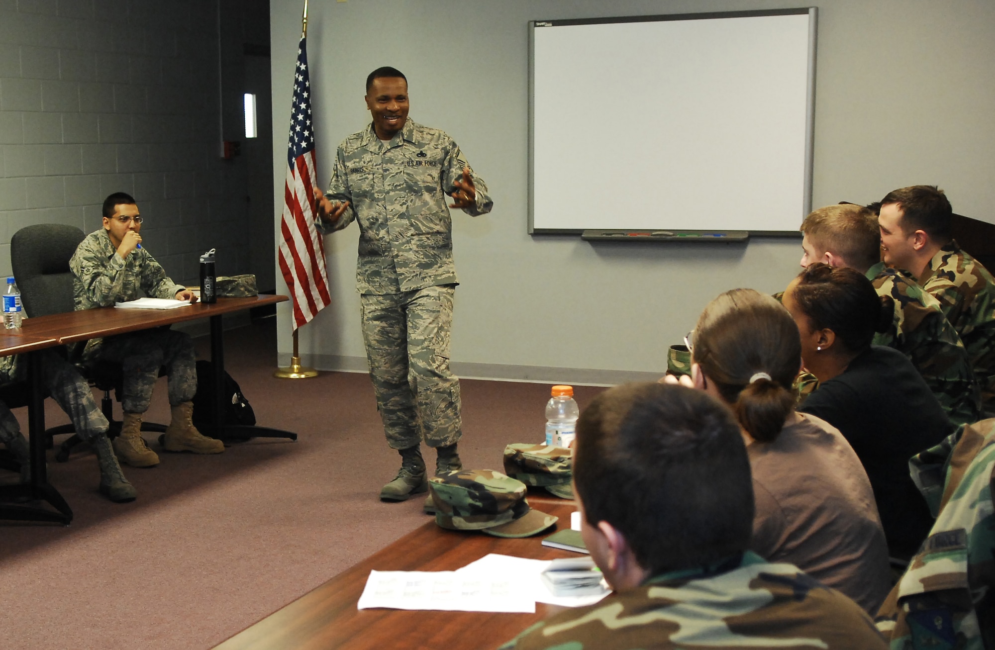 CANNON AIR FORCE BASE, N.M. - Master Sgt. Darrell Harris, 27th Special Operations Mission Support Squadron, speaks to the current class at the First Term Airmen's Center. Sergeant Harris found out he was stationed with an Airman from his BMT flight, Tech. Sgt. Jarvis Moore, 712th Maintenance Squadron (Provisional). The two sergeants hadn't seen each other in more than 20 years. (U.S. Air Force photo by Airman 1st Class Liliana Moreno)