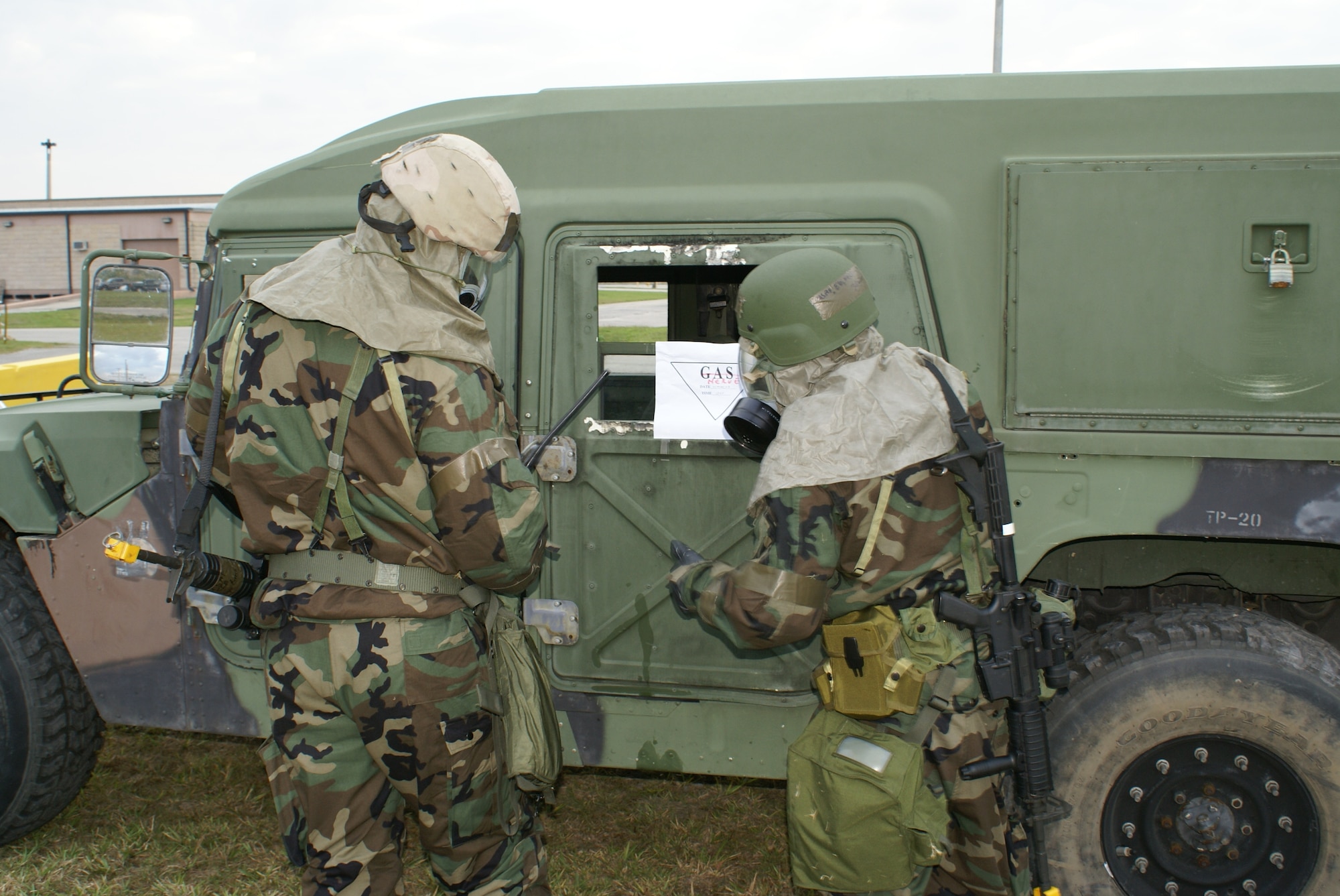 Tech. Sgt. Alexander Nelson and Senior Airman Sergio Greco, 482nd Security Forces Squadron, practice identifying a simulated chemical agent on a High Mobility Multipurpose Wheeled Vehicle during Operation Deliberate Tropic, Homestead Air Reserve Base, March 10, 2008.  The Operational Readiness Exercise is a self-assessment of the wing’s ability to perform in a simulated combat environment. Explosive devices, smoke grenades and sirens will be used during the exercise to create realistic scenarios that reservists will encounter during the exercise. “Homestead Air Reserve Base goes to great lengths to ensure safety procedures are established and followed during exercises to prepare our reservists for deployment,” said Mr. Sean Quinn, 482nd Mission Support Group Emergency Management Office. (U.S. Air Force photo/Tim Norton)