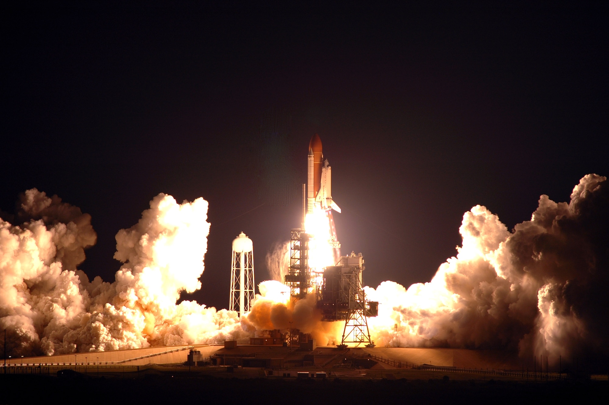 Space Shuttle Endeavour, on the STS-123 mission, lights up Launch Pad 39A and the night sky. Liftoff was on time  at 2:28 a.m. (EDT) March 11. The crew will make a record-breaking 16-day mission to the International Space Station and deliver the first section of the Japan Aerospace Exploration Agency's Kibo laboratory and the Canadian Space Agency's two-armed robotic system, Dextre. (NASA photo/Jim Grossmann)