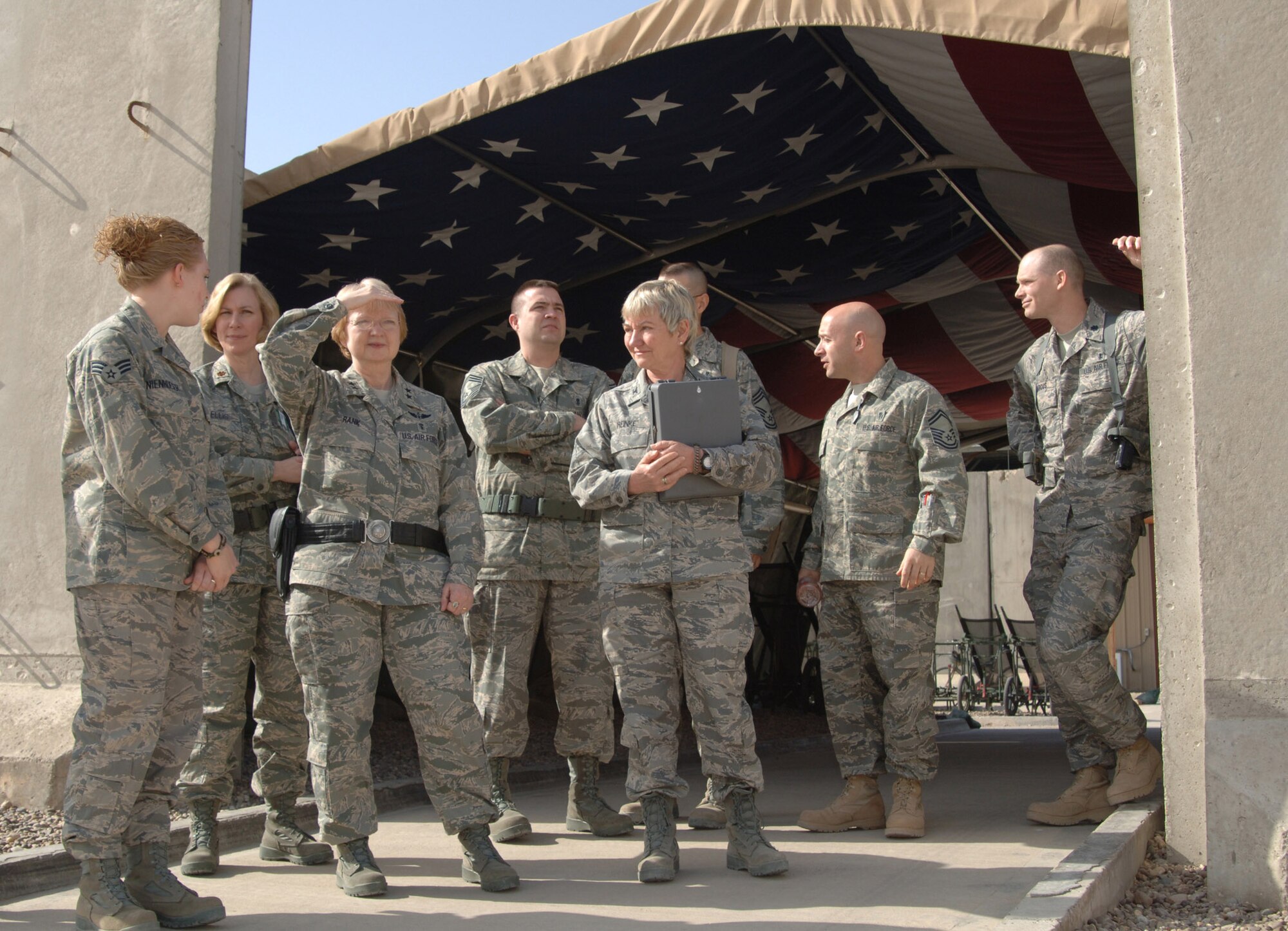 Maj. Gen. Melissa A. Rank (third from left) surveys the helicopter pad where sick and injured servicemembers are delivered to the Air Force Theater Hospital for treatment March 3 at Balad Air Base, Iraq. The general met with medics deployed to Balad AB March 3 to 4. General Rank is the assistant Air Force surgeon general for nursing services and medical force development. (U.S. Air Force photo/Master Sgt. Heather Cabral.)