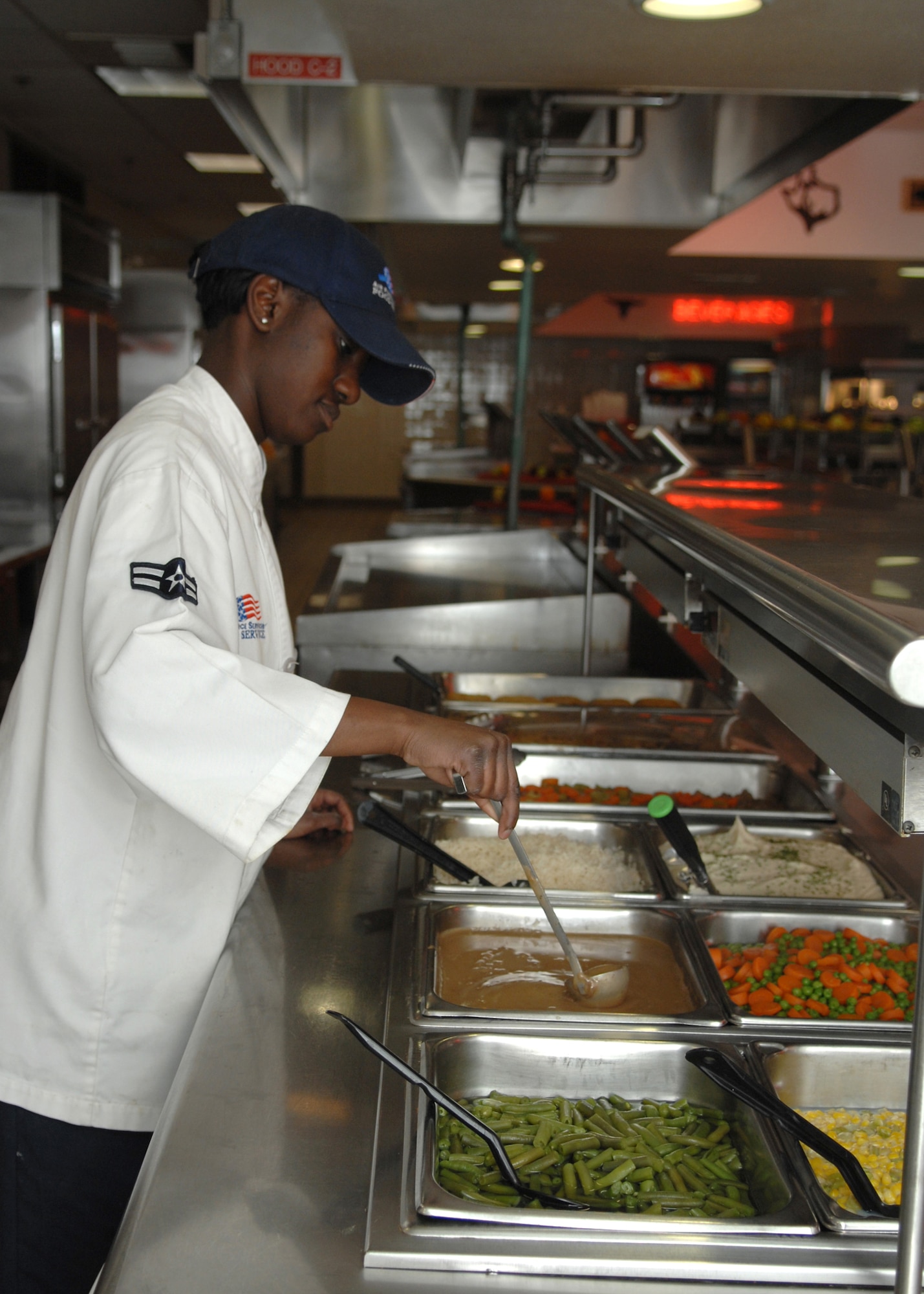 DYESS AIR FORCE BASE, Texas -- Airman 1st Class Britney Robinson, 7th Services Squadron, prepares the lunch line March 10. (U.S. Air Force photo by Airman 1st Class Jennifer Romig)