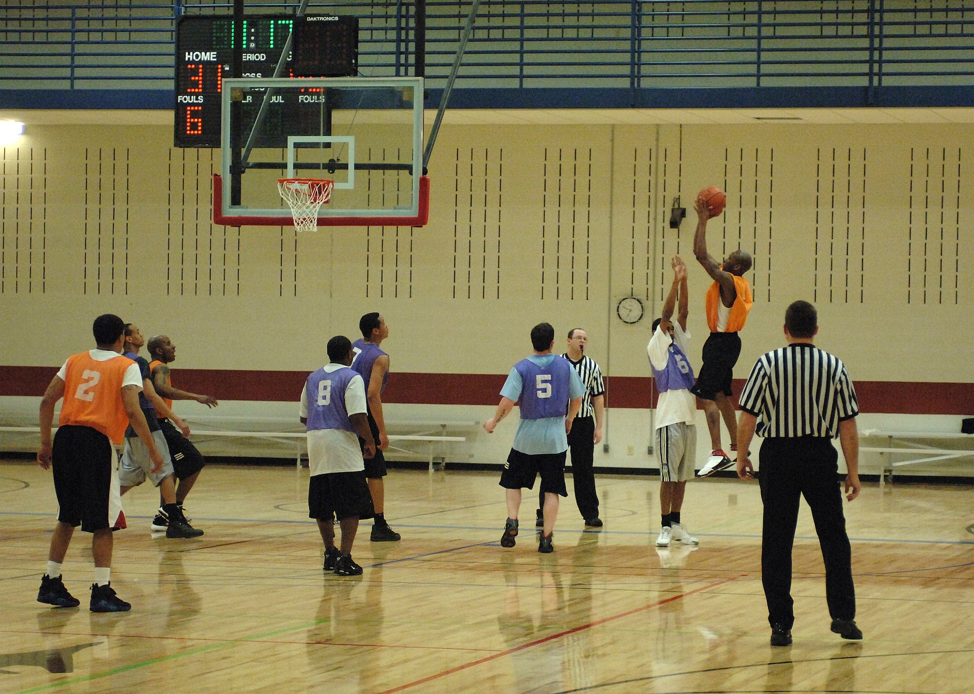 Kevin Jones, 28th Logistics Readiness Squadron shooting guard, attempts a three-point shot in the Ellsworth intramural basketball championship game March 6. Security forces won the championship in overtime with a final score of 79-71. (U.S. Air Force photo by Airman Corey Hook)  
