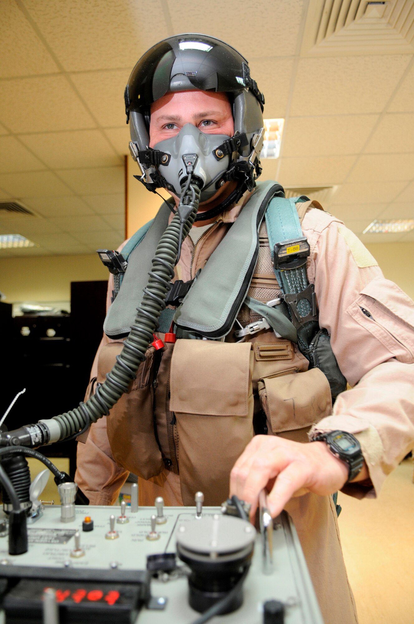 Lt. Col John Nichols, 37th Expeditionary Bomb Squadron director of operations and B-1 mission lead for a March 10 sortie, uses a SCOT tester at a Southwest Asia air base. Colonel Nichols uses the tester to pressure check his mask for any leaks and integrity of the seal.  He is from Huron, Ohio deployed from Ellsworth Air Force Base, S.D. (U.S. Air Force photo/Tech. Sgt. Johnny L. Saldivar)