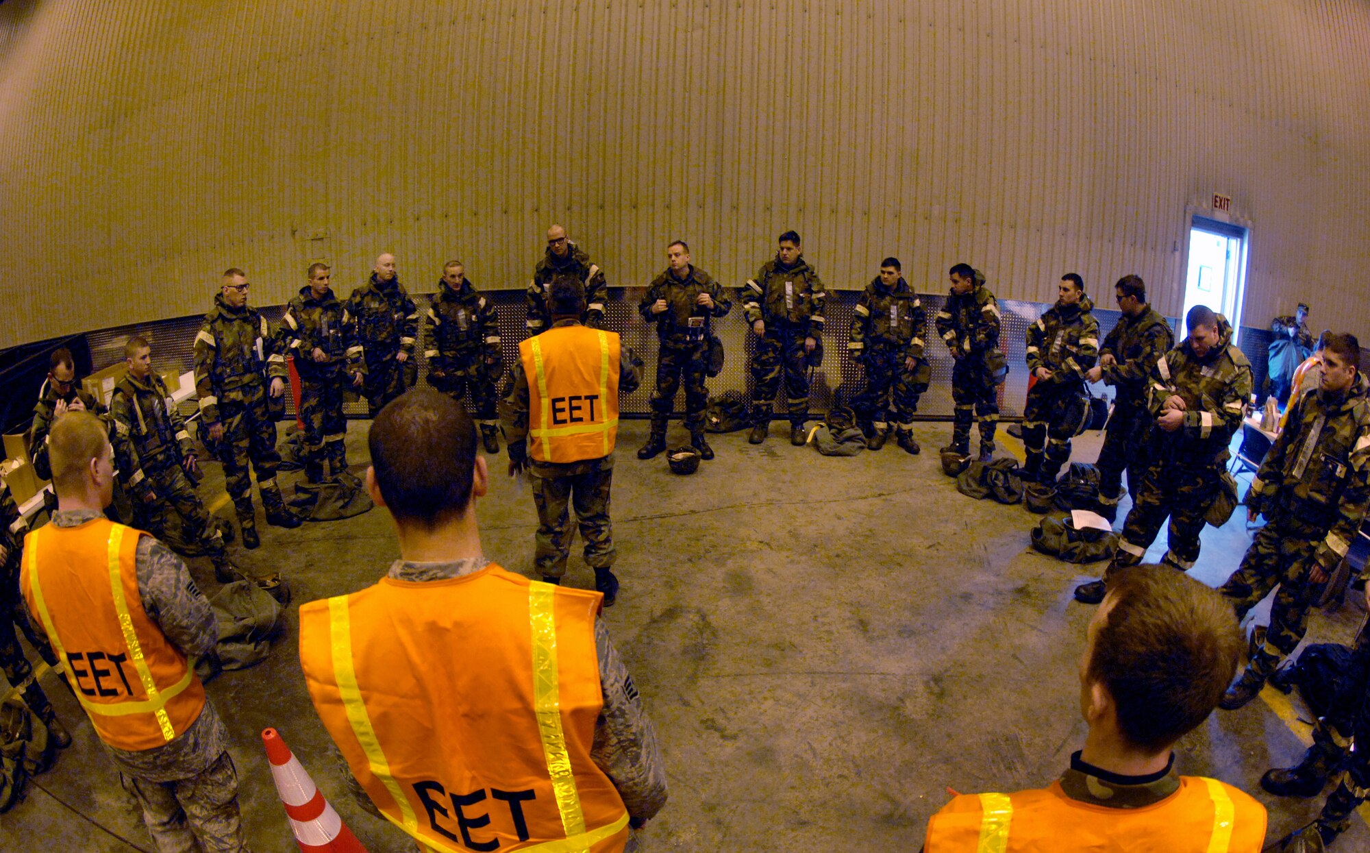 Senior Master Sgt. Cleofas Trejo (center) briefs members of the 354th Fighter Wing on the evaluation of the Ground Crew Ensemble portion of the GOLDEN RAVEN 08-02 operational readiness exercise on March 9, 2008 at Eielson Air Force Base, Alaska.  GOLDEN RAVEN's purpose is to evaluate the 354th Fighter Wing's ability to prepare and deploy personnel, equipment and support assets to a combat environment. The exercise consists of four graded areas: initial response and deployment, employment, ability to survive and operate (ATSO) and combat response.

(U.S Air Force photo by Staff Sgt. Eric T. Sheler)
