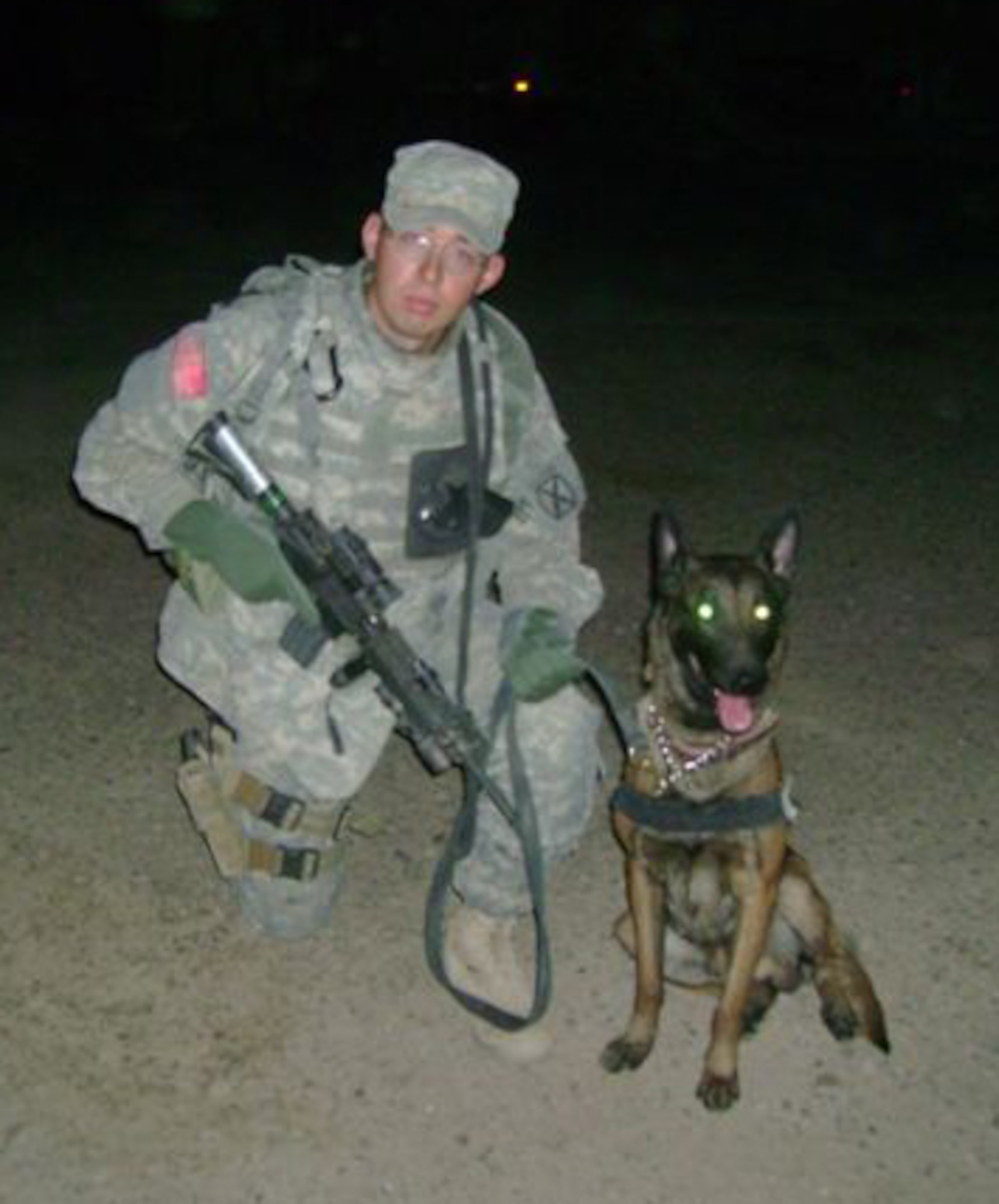 LAUGHLIN AIR FORCE BASE, Texas – Senior Airman Ryan Troester, 47th Security Forces Squadron K-9 Division, and his military working dog Xxavier recently returned from a deployment to Southwest Asia in support of Operation Iraqi Freedom.  (Contributed photo) 