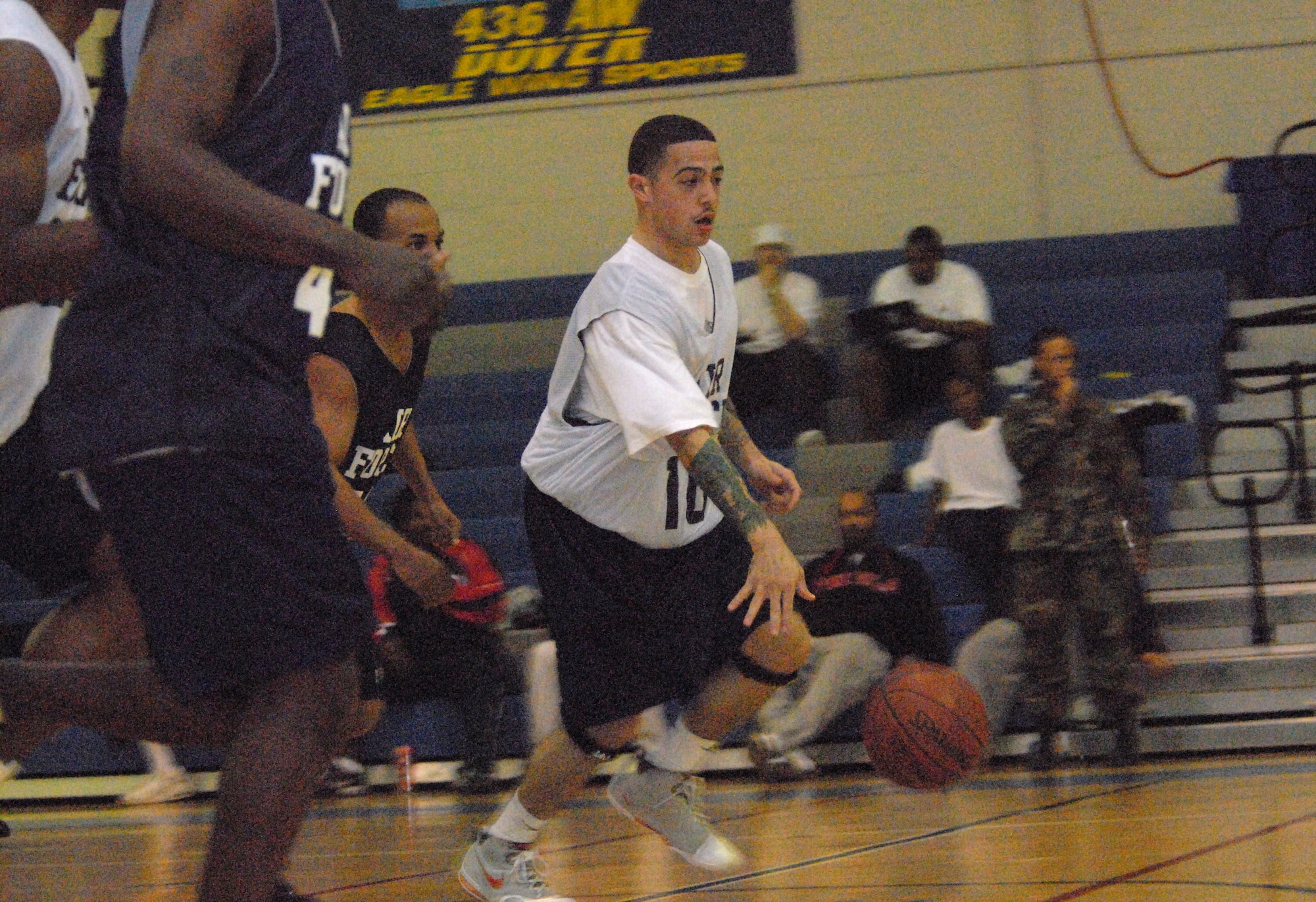 Staff Sgt. Ricardo Bachelor, from Osan Air Base, Korea, dribbles the ball down the court at the Fitness Center. Sergeant Bachelor traveled to Dover Air Force Base along with 18 other Airmen from throughout the Air Force for one reason: to earn a coveted spot on the All-Air Force Basketball team. (U.S. Air Force photo/Airman 1st Class Shen-Chia Chu)
