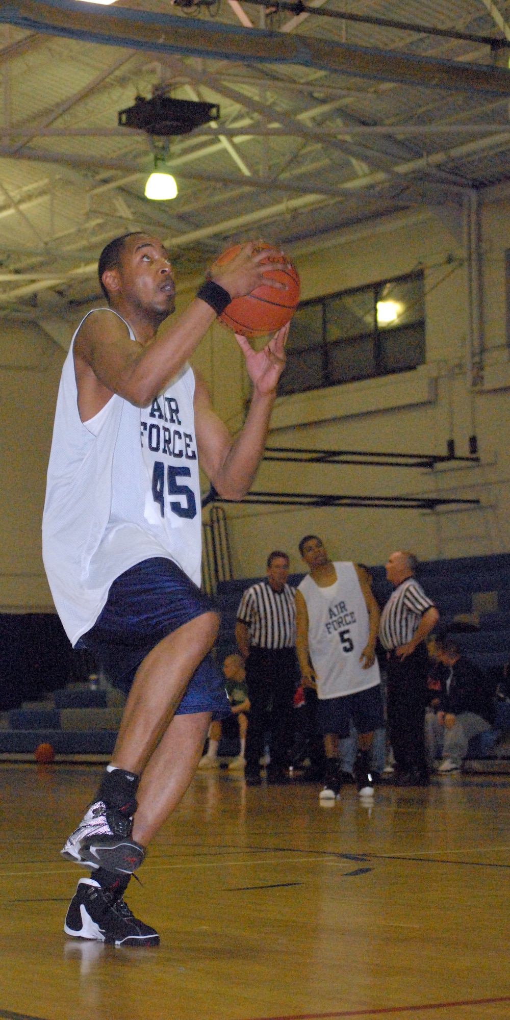 Senior Airman Wayne Wooley, from Osan Air Base, Korea, prepares to make a lay-up during practice at the Fitness Center here. Nineteen Airmen from all over the world have come to Dover Air Force Base for the All-Air Force Basketball try-outs throughout March. (U.S. Air Force photo/Airman 1st Class Shen-Chia Chu)