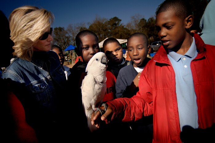 Fifth-graders from Goodwin Elementary School in North Charleston, S.C., react to a bird saying "I love you" during the Earth Day celebration on base Wednesday. (U.S. Air Force photo/Senior Airman Nicholas Pilch)