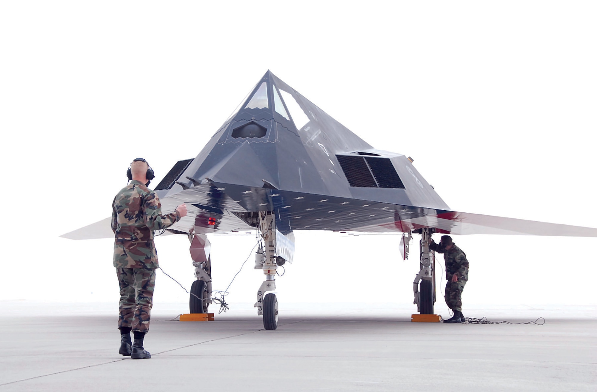 Airmen deployed from the 49th Fighter Wing prepare to launch an F-117A Nighthawk from a foggy ramp at Wright-Patterson Air Force Base on Mar. 11. After 27 years of  service Air Force officials will retire the F-117 fleet to free up funds for modernization.  (U.S. Air Force photo/Christy Webb)