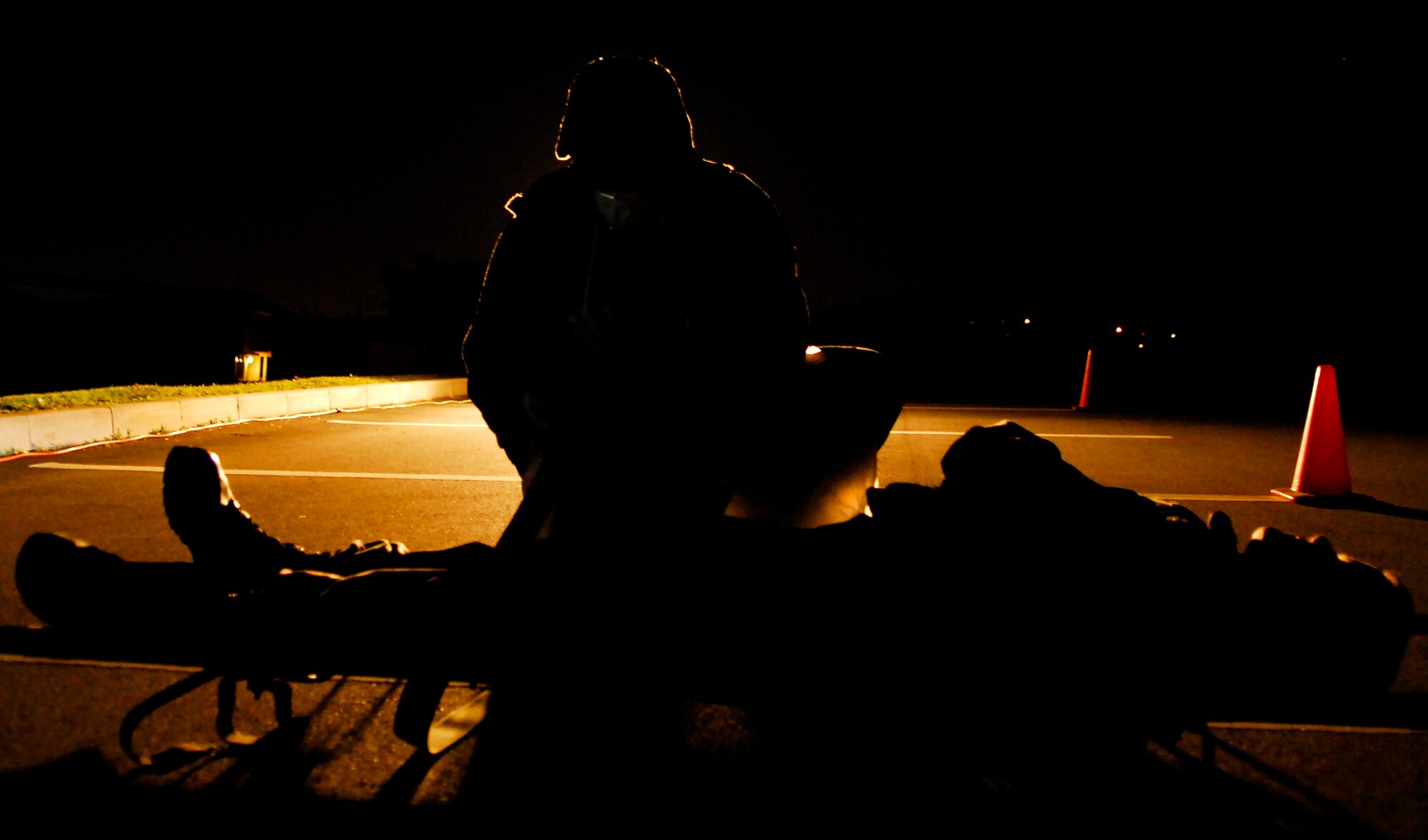 A simulated casualty brought to the morgue gives 18th Services Airmen an opportunity to practice processing  paperwork and verifying procedures for shipping the body back to the U.S. The casualty is part of an exercise scenario during the 2008 Pacific Air Forces Operational Readiness Inspection at Kadena Air Base, Japan, March 13, 2008. PACAF conducted the inspection from March 9 to 15 to validate mission readiness of the 18th Wing. (U.S. Air Force photo/Staff Sgt. Joshua J. Garcia) 