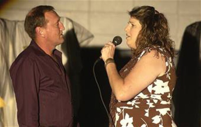Coast Guard Chief Petty Officer Mike Hemphill, Naval Engineering Support Unit Charleston, and his wife, Kim, sing "You Don't Bring Me Flowers" at the 2007 Family and Teen Talent Contest on base Sept. 28, 2007. The couple recently took first place in the husband and wife category at the Air Force level. (U.S. Air Force photo/Tech. Sgt. Paul Kilgallon)  