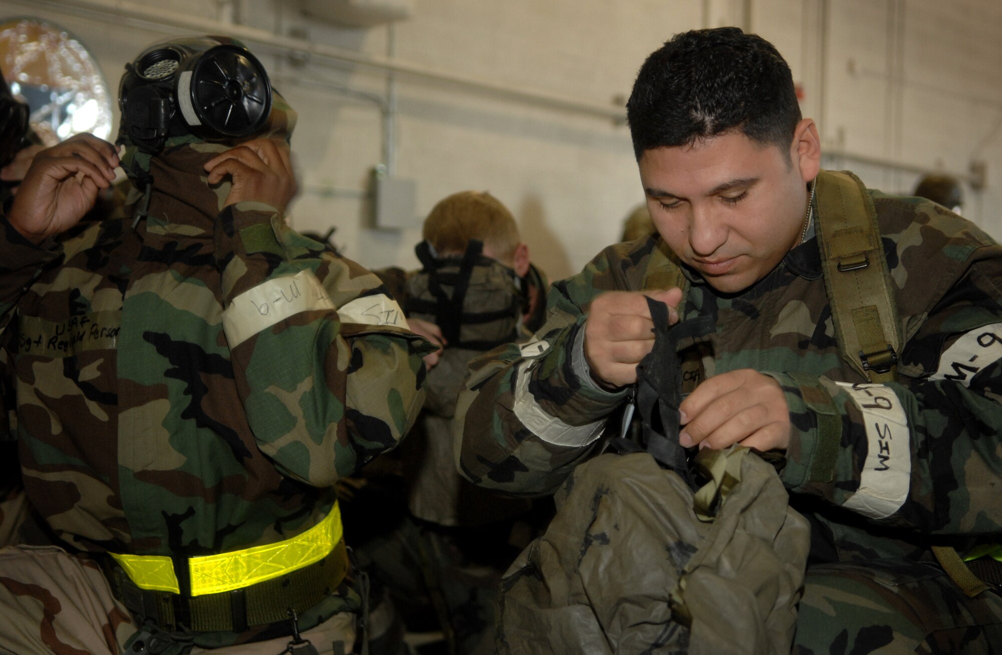 LANGLEY AIR FORCE BASE, Va. -- Staff Sgt. Allan Arcia, 1st Aircraft Maintenance Squadron, dons his chemical warfare gear during the Operational Readiness Inspection training day here March 11, where Airmen prepared for Langley’s upcoming ORI, which is scheduled for April. During the training, troops practiced their ability to survive and operate, perform post attack reconnaissance, self-aid buddy care, and went over material from the Airman’s manual and general knowledge on military operations. (U.S. Air Force photo/Senior Airman Cecil C. McCloud)