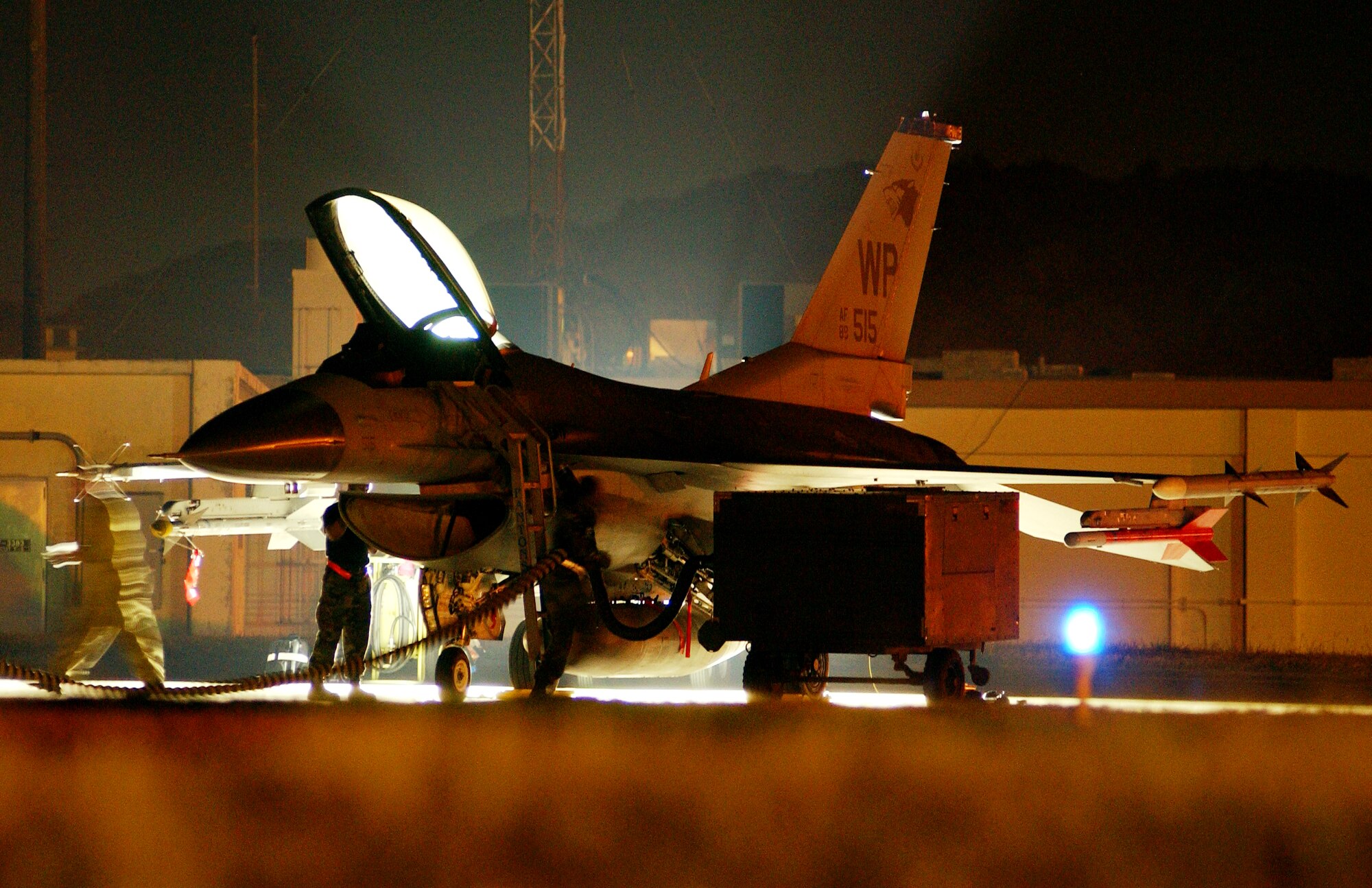 Maintainers from the 8th Maintenance Squadron, Kunsan AB, South Korea, perform standard checks on an F-16 CG Falcon during the 2008 Pacific Air Forces Operational Readiness Inspection at Kadena Air Base, Japan, March 12, 2008.   The 8th Fighter Squadron jets are assisting the 18th Wing during the ORI by playing the role of “aggressors.”   PACAF is conducting the inspection from March 9 to 15 to validate the mission readiness of the 18th Wing. (U.S. Air Force photo/Tech. Sgt. Rey Ramon) 
