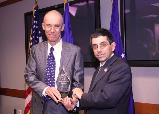 Dr. Terry Lyons (L), deputy for technology transition at AFOSR receiving Air Force science and engineering award from Dr. Mark Lewis (R), chief scientist of the Air Force at AFOSR in Arlington, Va.