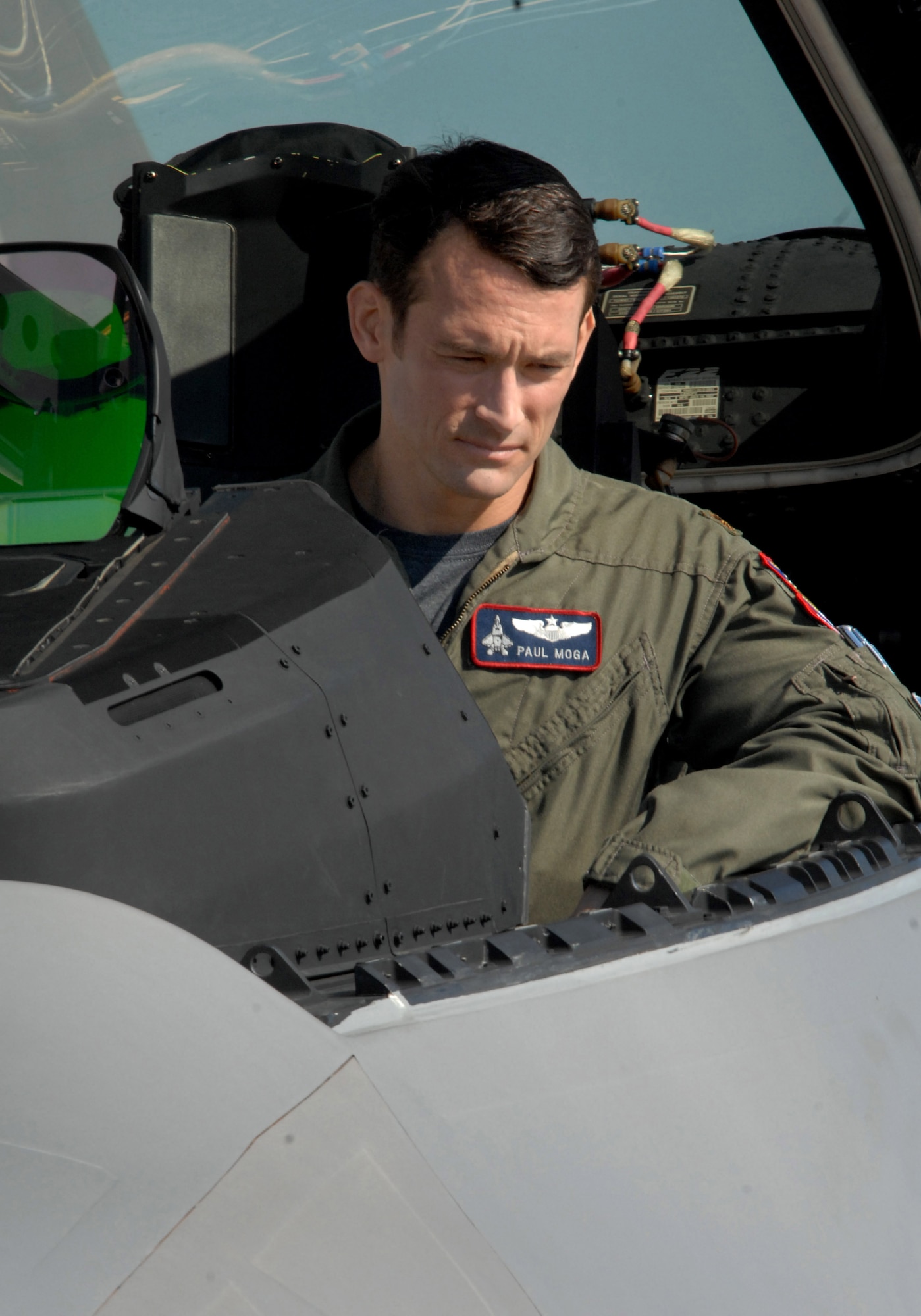 LANGLEY AIR FORCE BASE, Va. -- Maj. Paul Moga, F-22 demonstration pilot, hosts an episode from the series “Showdown: Air Combat,” a Discovery Military Channel production filmed here March 11. While Major Moga will host the entire series, which highlights a number of military aircraft, the Langley episode will highlight the F-22 and its capabilities. The series is scheduled to premiere in June. (U.S. Air Force photo/Senior Airman Cecil C. McCloud)   