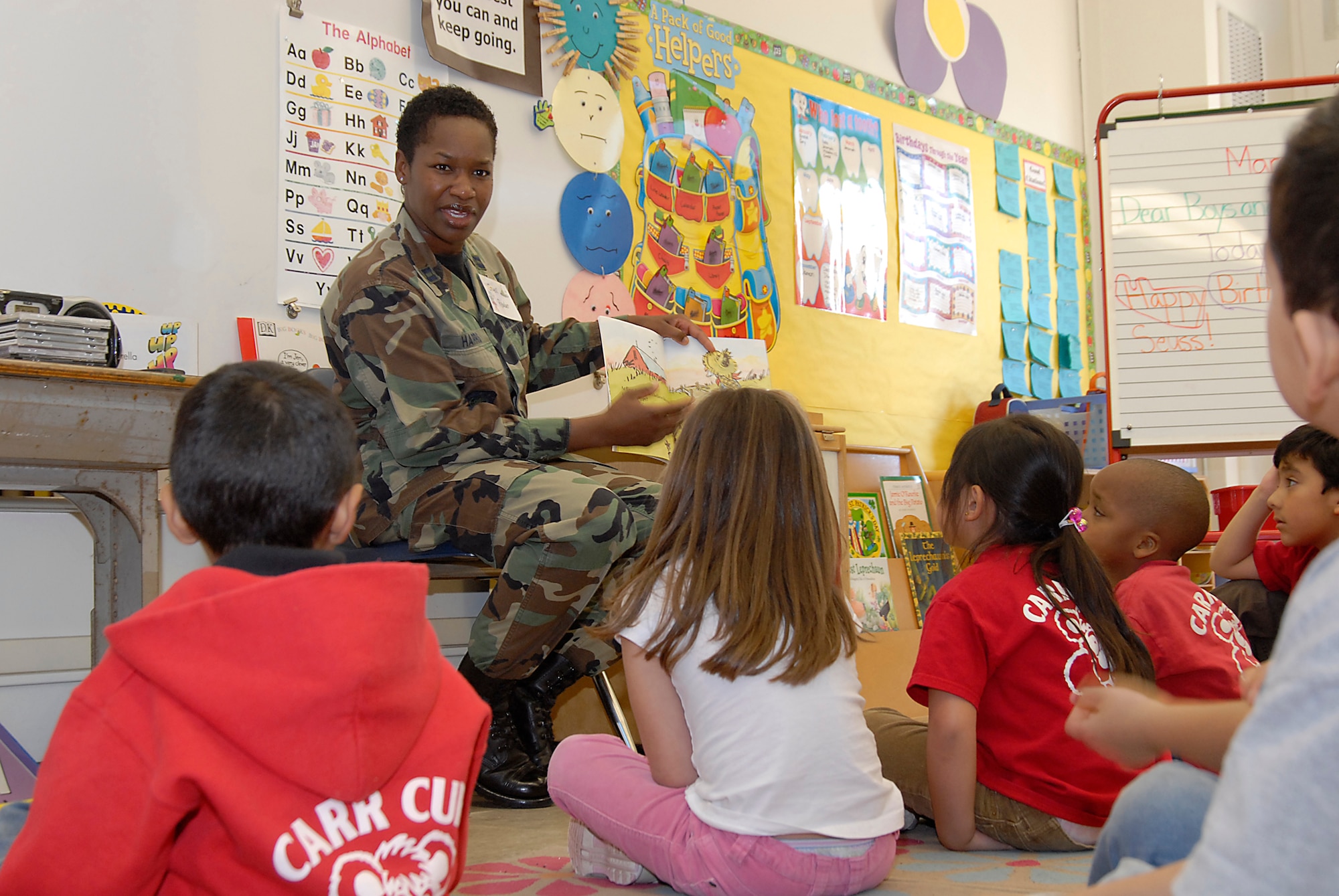 Capt. Veronica Harris read to students at Torrance’s Carr Middle School’s Read Across America event, March 7. More than 30 Los Angeles AFB military and civilian personnel participated this year. The reading event is held annually nation-wide and marks Dr. Seuss’ birthday. (Photo by Joe Juarez)