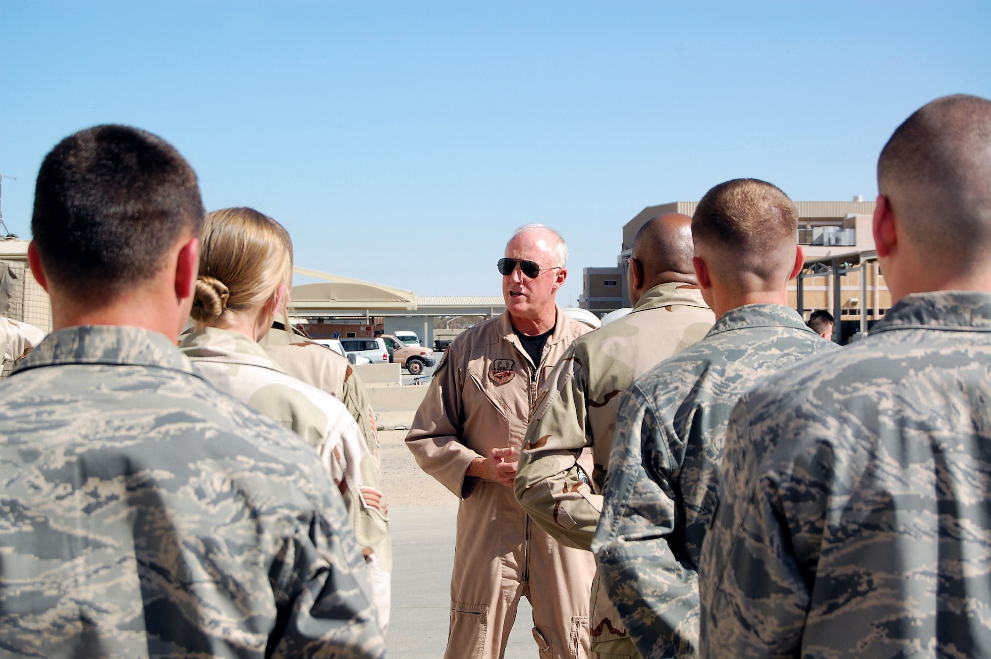 Brig. Gen. Thomas Haynes discusses deployed air mobility operations with Airmen during a March 8 visit to a Southwest Asia air base. General Haynes, the U.S. Air Forces Central director of mobility forces, visited the 386th Air Expeditionary Wing to see firsthand how Airmen support the deployed airlift mission. (U.S. Air Force photo/Capt. Jason McCree) 

