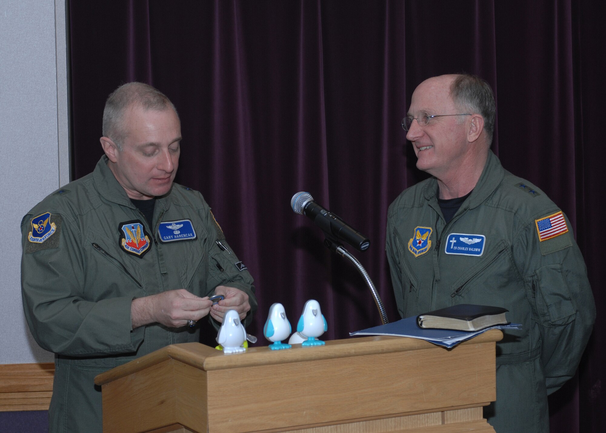 WHITEMAN AIR FORCE BASE, Mo. – Brig. Gen. Gary Harencak, 509th Bomb Wing Commander, presents a coin to Chaplain (Maj. Gen.) Charles Baldwin, Air Force Chief of Chaplains, at the Whiteman National Prayer Breakfast March 11. (U.S. Air Force photo/Tech. Sgt. Samuel A. Park)


