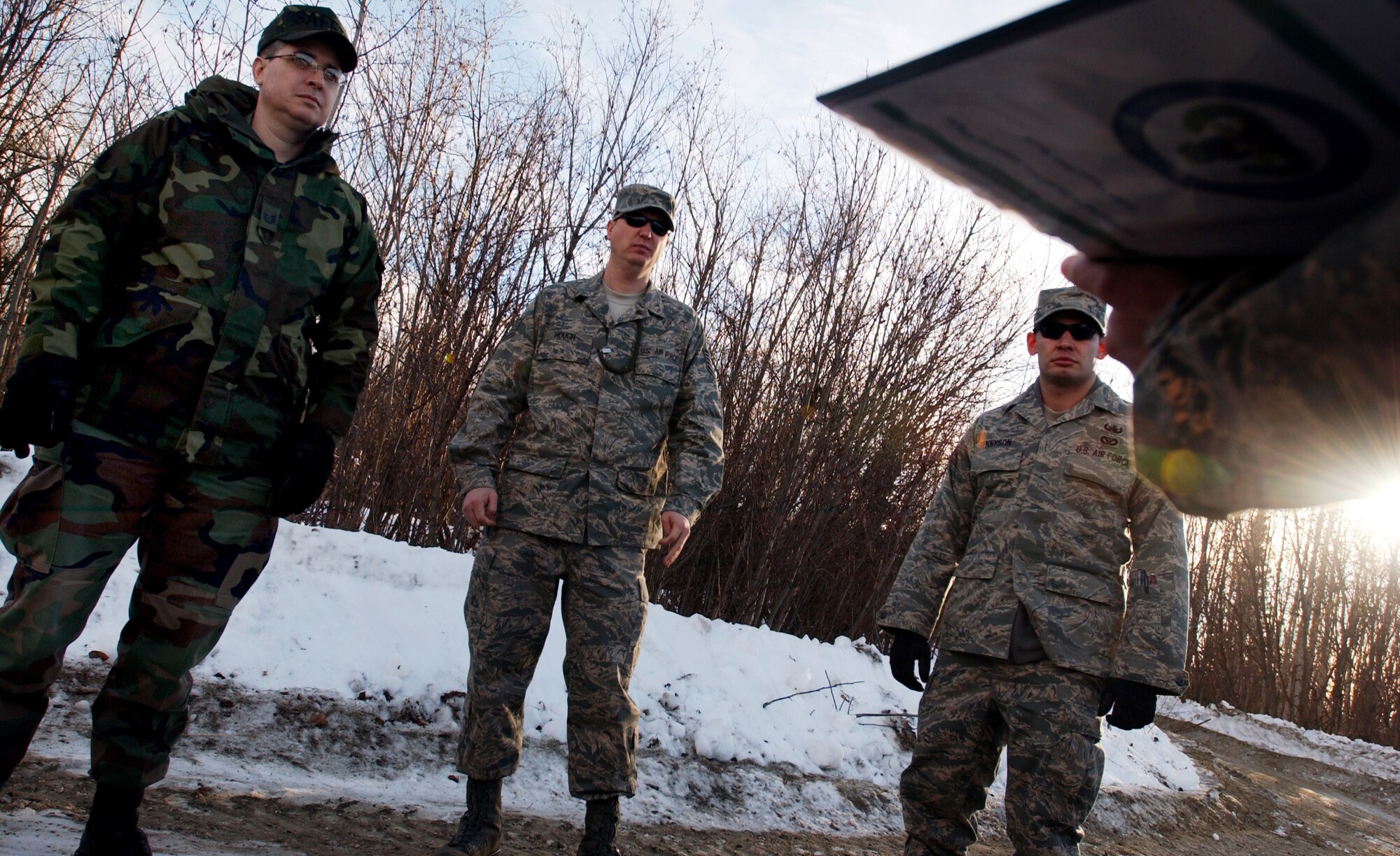 (From left to right) Tech. Sgts. Billy Swartzel, John Hough and Staff Sgt. Ryan Tennyson receive a safety briefing prior to explosive ordnance (EO) training Feb. 21, 2008 at Eielson Air Force Base, Alaska.  The safety briefing provides essential information and safety procedures on the types of explosives detonated during the EO training. (U.S Air Force photo by Staff Sgt Eric T. Sheler)