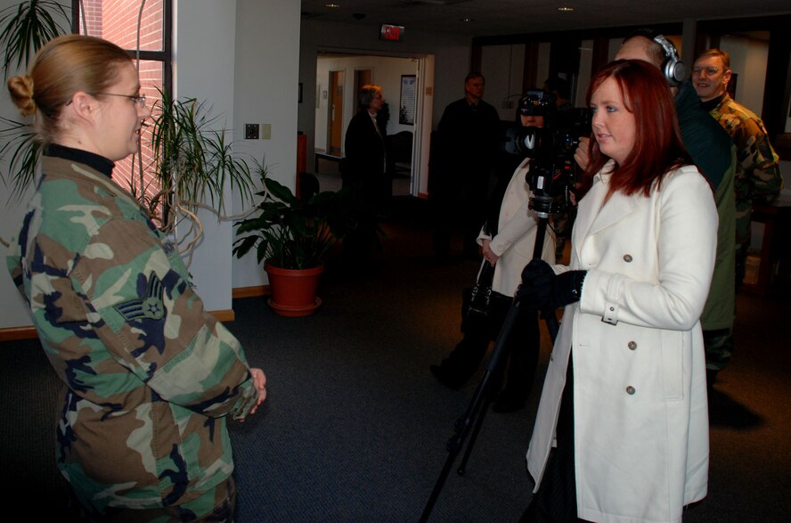 The 932nd Airlift Wing's chapel staff, including Senior Airman Heather Johnson, welcomed three broadcasters from the University of Illinois during a recent tour.  Photo/Tech Sgt. Dan Oliver