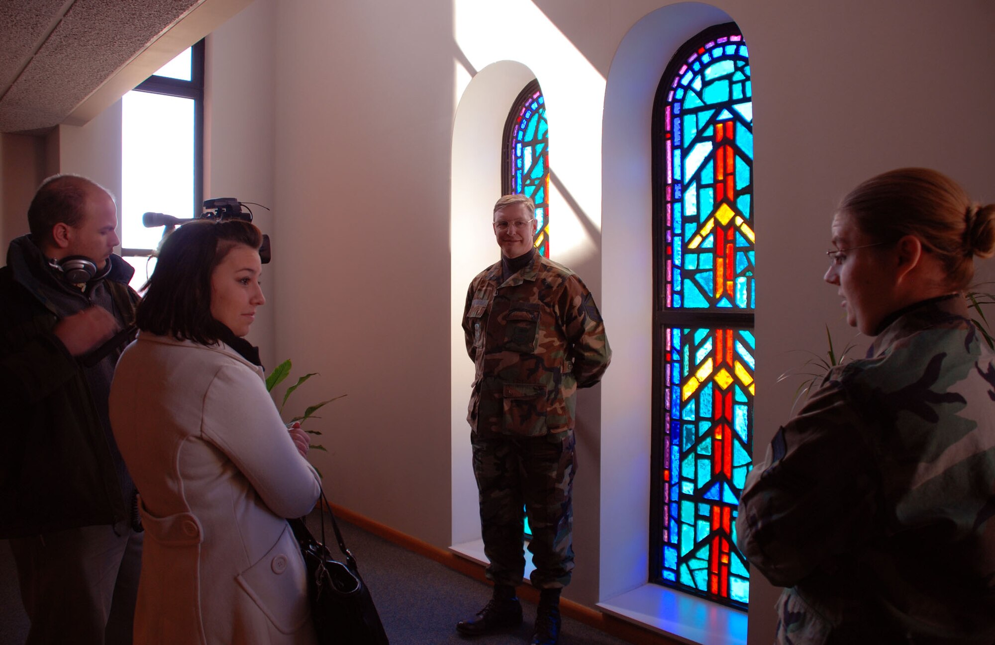 The 932nd Airlift Wing's chapel staff, including Master Sgt. Harold Von De Bur and Senior Airman Heather Johnson, welcomed three broadcasters from the University of Illinois during a recent tour.